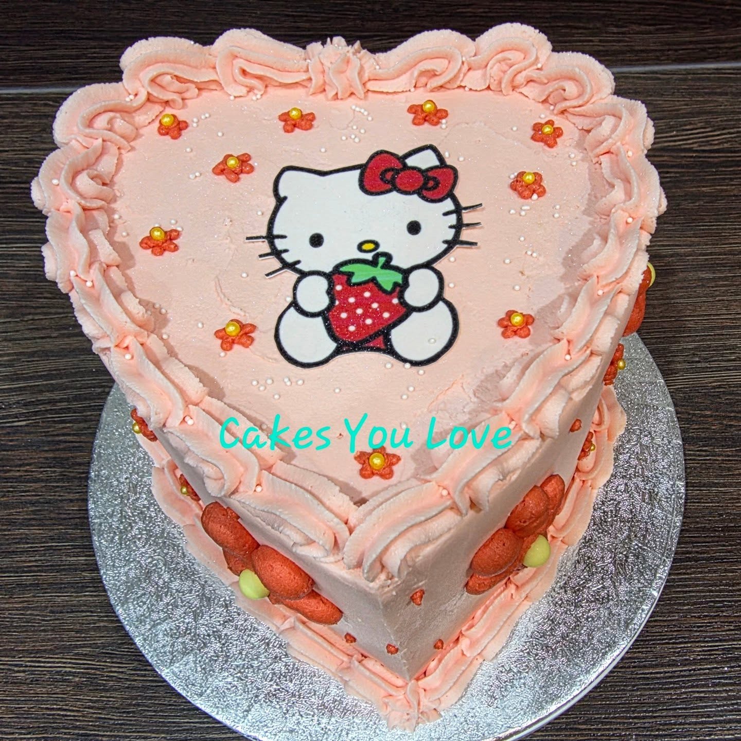 A cute heart shaped birthday cake to celebrate an 18th