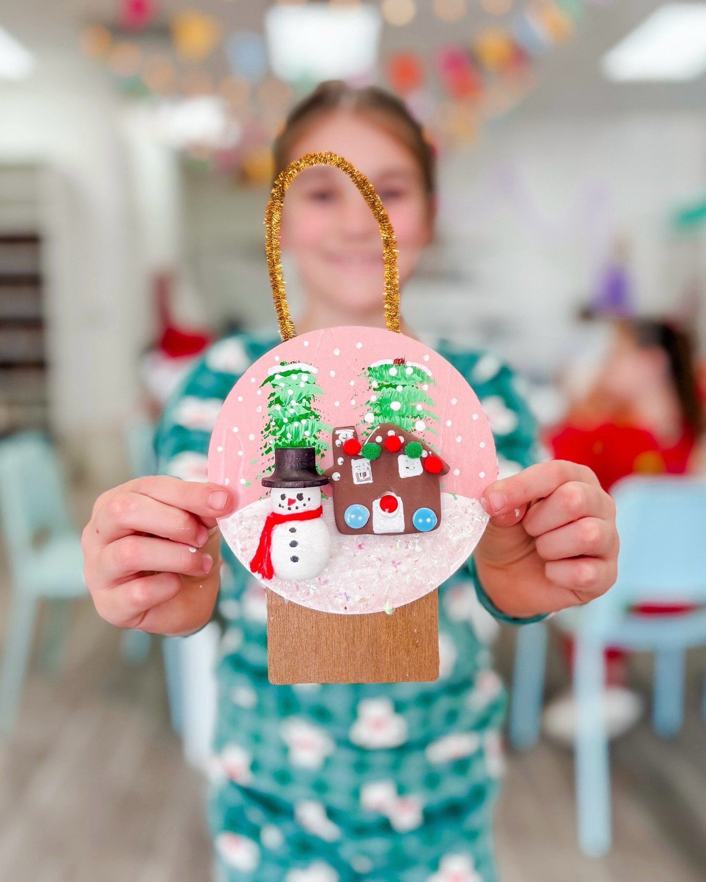 Artists used wood, clay, fiber, iridescent snow, acrylic paint and lots of fun embellishments to create the sweetest little snowglobe scene!