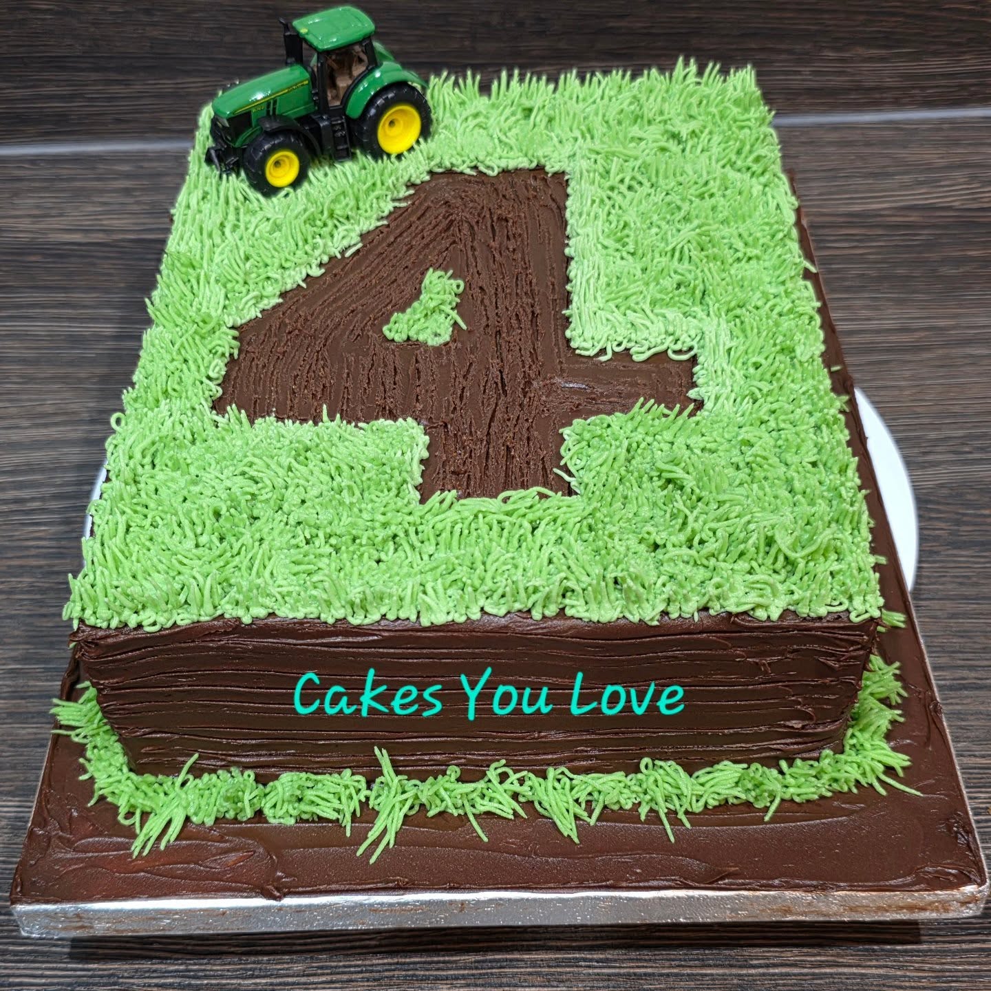 A cute cake for a little boy who loves his tractors. Toy was bought as a gift to keep too