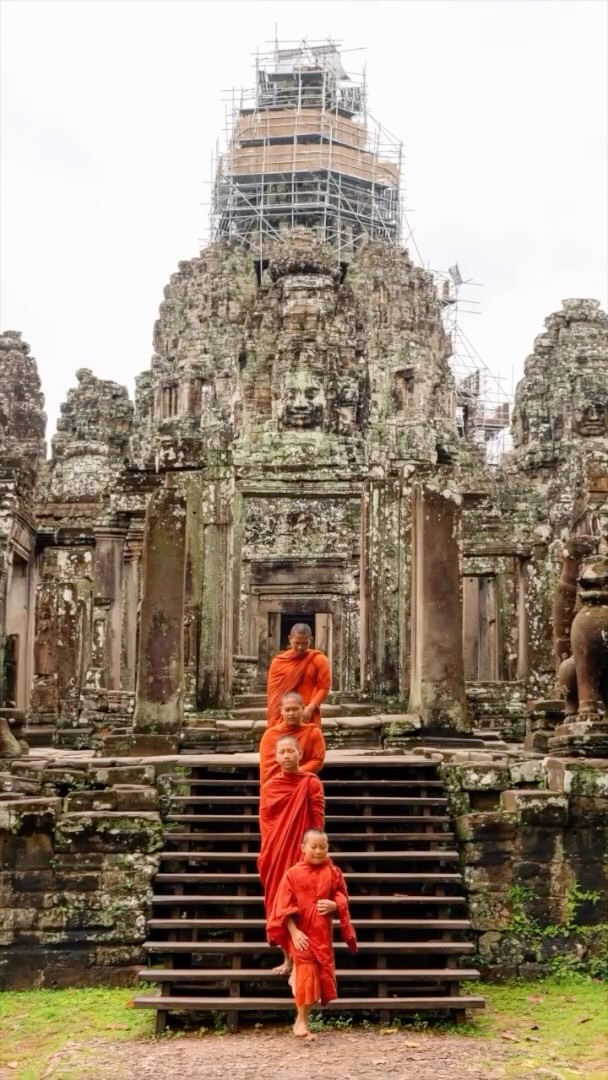 Monks visiting the Bayon Temple give an extra element worth photographing. There are over 200 stone faces and one of the most striking in the Angkor Wat region #cambodiatravel #cambodia #phototour