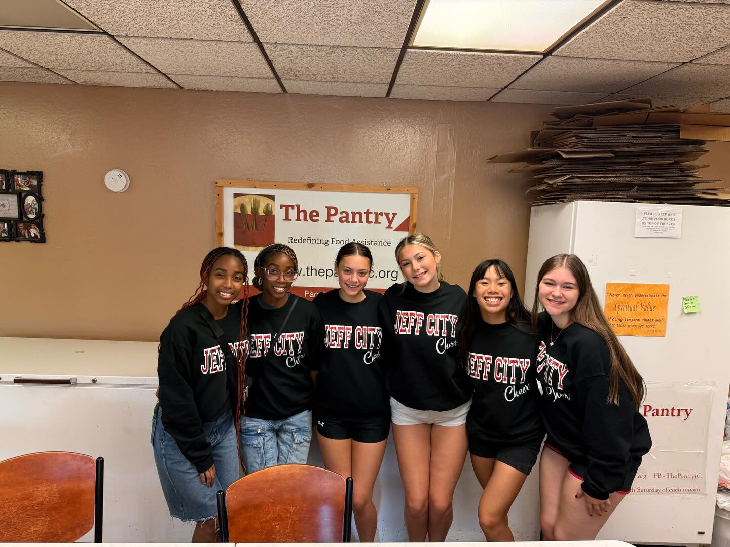 The Jefferson City Cheer Team had the opportunity to volunteer at the local food bank, and it was an incredibly rewarding experience. Our team worked together to sort donations, organize food items, and help prepare packages for families in need. It was inspiring to see everyone give their time, energy, and teamwork to support our community.