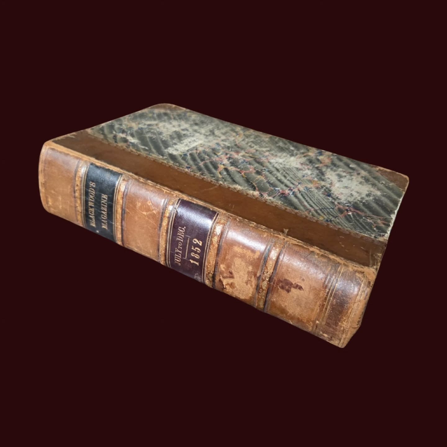 https://www.objetdart-stuff.co.uk/product-page/antique-1852-blackwood-s-edinburgh-magazine-july-december-half-leather-bound
Antique 1852 Blackwood’s Edinburgh Magazine – July–December – Half Leather Bound Literary Volume with Binder’s Ticket & Visible Binder’s Waste
.
Step back into the literary, political and cultural world of mid-Victorian Britain with this wonderfully characterful 1852 bound volume of Blackwood’s Edinburgh Magazine — one of the most influential periodicals of the 19th century.
.
Beautifully bound in the period in half leather with marbled boards and page edges, this handsome, time-softened volume gathers together the complete run of issues from July to December 1852 (Volume LXXII), printed by William Blackwood & Sons, Edinburgh & London.
.
This is a book that doesn’t just hold history — it feels like it.