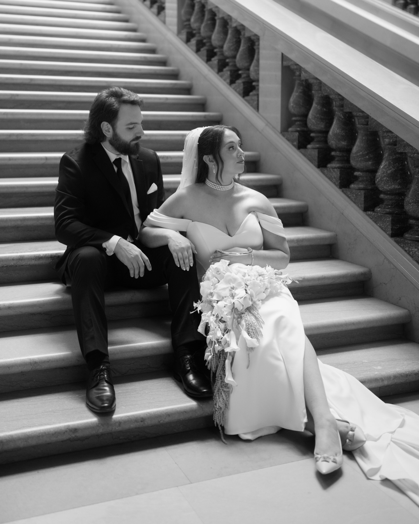 Sharing some more from S + B’s moody, editorial, and elegant wedding portraits at the Wisconsin State Capitol below. 🖤
The couple had their wedding reception at the Madison Club, and you can see the rest of the photos from their wedding day in the blog linked in my bio.
The bride and bridesmaids got ready in the Mendota Room and the groom and groomsmen got ready in the library. The bride and groom did their first look out in front of the building followed by couples portraits at the Wisconsin State Capitol.
The couple had their ceremony in the black butterfly fireplace room with a string quartet playing followed by cocktail hour. The dinner and dancing reception was in the basement atrium with its stunning glass ceiling and sparkling chandeliers. Guests dined by candlelight, and there were passed espresso martinis after dinner.
All of the details from this day were so gorgeous. The couple had a large wedding party, the bridesmaids wore black bridesmaids dresses and had small white calla lily bouquets with pearl details. I especially also love the three tired Lambeth cake. The bride’s dress had a basque waist with off the shoulder sleeves. She also had a dress change for the dancing part of the reception that was elegant and sparkly with gloves.
We also created some stunning formally posed wedding party and family photos, think “Downton Abbey” or “drawing room” style portraits with people both sitting and standing in a grand interior setting with elegant postures. I’m a huge fan of these historically vintage Victorian and Edwardian styling details for wedding trends.
Enjoy the photos and use them for inspiration for planning your own wedding!
Second shot for Valerie Halling at The Madison Club in Madison, Wisconsin
Keywords
Madison Wisconsin Wedding Photographer | Madison Wedding Photographer | Madison Wedding Venues | Wisconsin Wedding Photographer | Madison Wedding Wisconsin Engagement Photographer | Wedding Photographer | Wedding Inspiration | Wisconsin Wedding | Wedding 2026 | Downtown madison wedding ceremony | Wisconsin State Capitol Wedding
