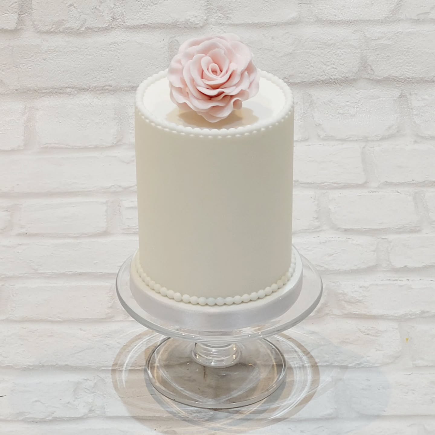 Tall 4" Dummy Wedding Cake with a handmade Sugar Rose for a Clients Wedding.
#cakesofinsta #cupcakesofinsta #weddingcake #cakemaker #northwalescakes