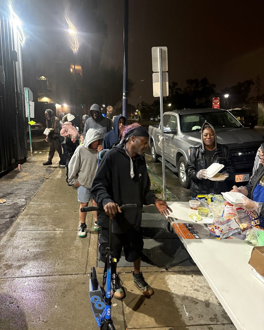 The rain didn't dampen our spirits, and neither did it stop us from serving a hot meal to those in need. #Grind2gether#, it's always there. Our volunteers were beaming with enthusiasm, and Brandy and Ray saved the night with more food. Jesus Antunes it’s a regular now that has joined the team, bringing a friend to lend a hand. I'm grateful for each one of you.
