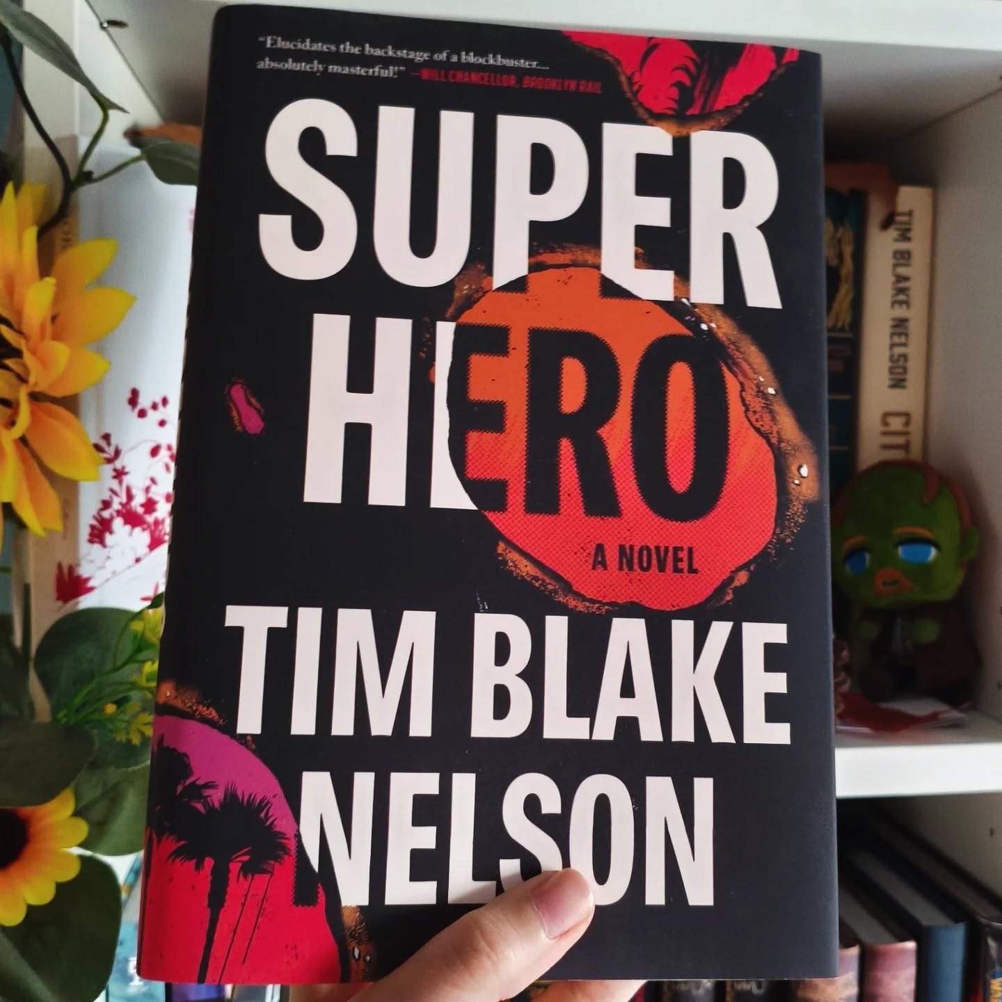 Superhero by Tim Blake Nelson.
I was SO looking forward this book and I liked it so much it took me two days to read lol.
I'll talk about it longer in my blog in the upcoming days because I have a lot to say but when I read it I didn't read it as a Tim fan, I read it as a comics books fan because he said it was the public he was aiming at. And honestly I didn't see how a novel about cinema couldn't be appealing for comic books fans, even if it's centered around CBM it's still about movies after all. But after a few pages I understood.
You won't more than small Easter eggs to comics but you'll find a genuine respect and curiosity for comic books and their fans.
I loved his first book but it was somewhat complicated to read, felt deorganized sometimes and it was too complicated to follow for someone who isn't in that industry imo. But this one was a very smoothie read, nice story with interesting characters, a way better balance between the main topic and everything he wants to talk about through it. It was very good.