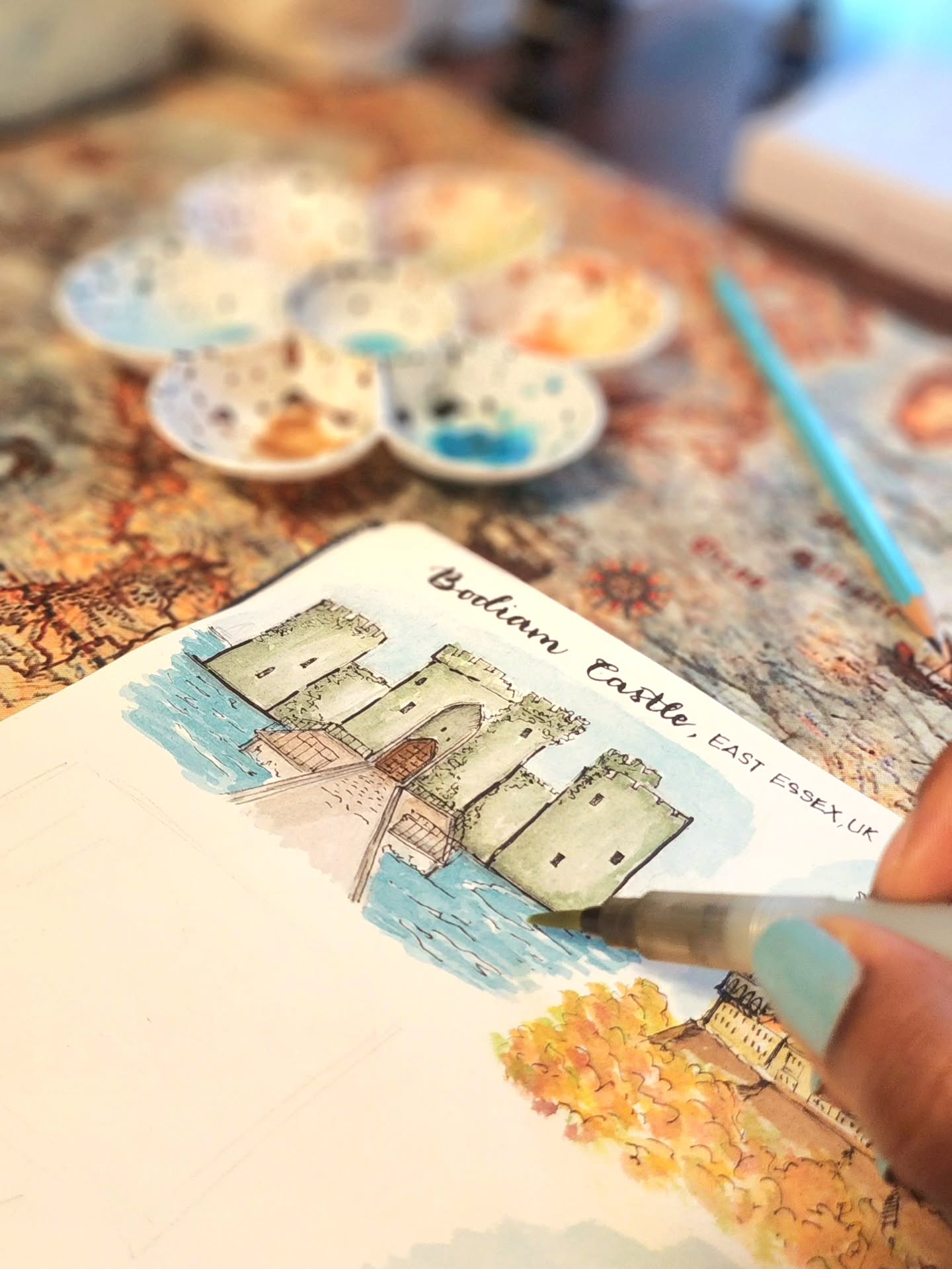✨️ Started 2026 with the final brushstrokes of Bodiam Castle, East Essex, England.
I gave it my own spin in blues and greens — a place that feels like walking through medieval times. Painting architecture and travel moments feels like the perfect way to begin a new year — continuing a story I started during the frenzy of the holiday season 🤣✨
Photo description:
Adding the final details to a watercolor painting of Bodiam Castle. The castle is painted in soft blues and greens, with a slightly dreamy, reimagined feel, reflecting my personal color palette and love for architectural travel scenes.
#MemoriesOfForgottenCastles #TravelThroughArt #ArchitecturalIllustration #SlowArtProcess #StorytellingThroughArt
