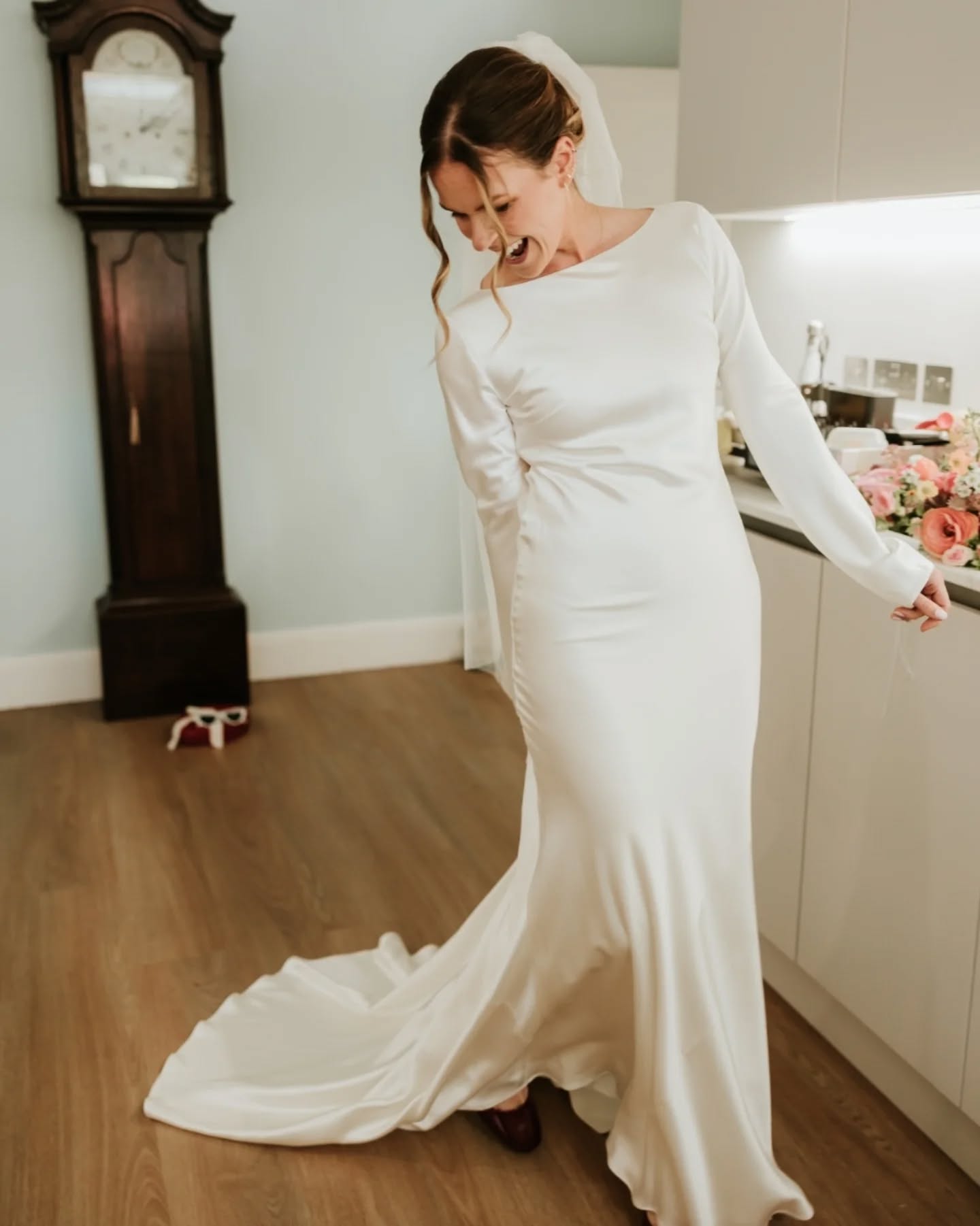 Nothing quite beats the warmth of getting ready on your wedding morning in your childhood home. Bouquet in the kitchen sink, the heirloom grandfather clock proudly watching over and the elderly cat showing a peek. What a way to add even more memories to such a special place.