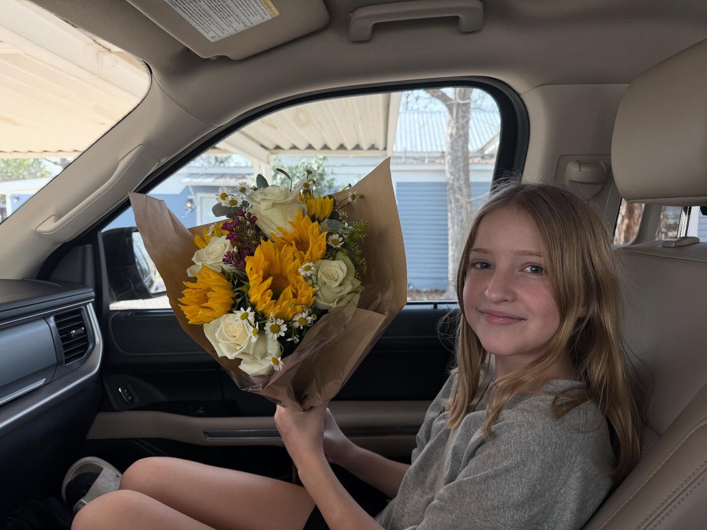 One of my amazing clients gave me flowers during their prenatal appointment today!
I meant to take a photo with them but forgot while we got to chatting. So instead you get a photo of Lilah with them. 😂
Thank you guys!