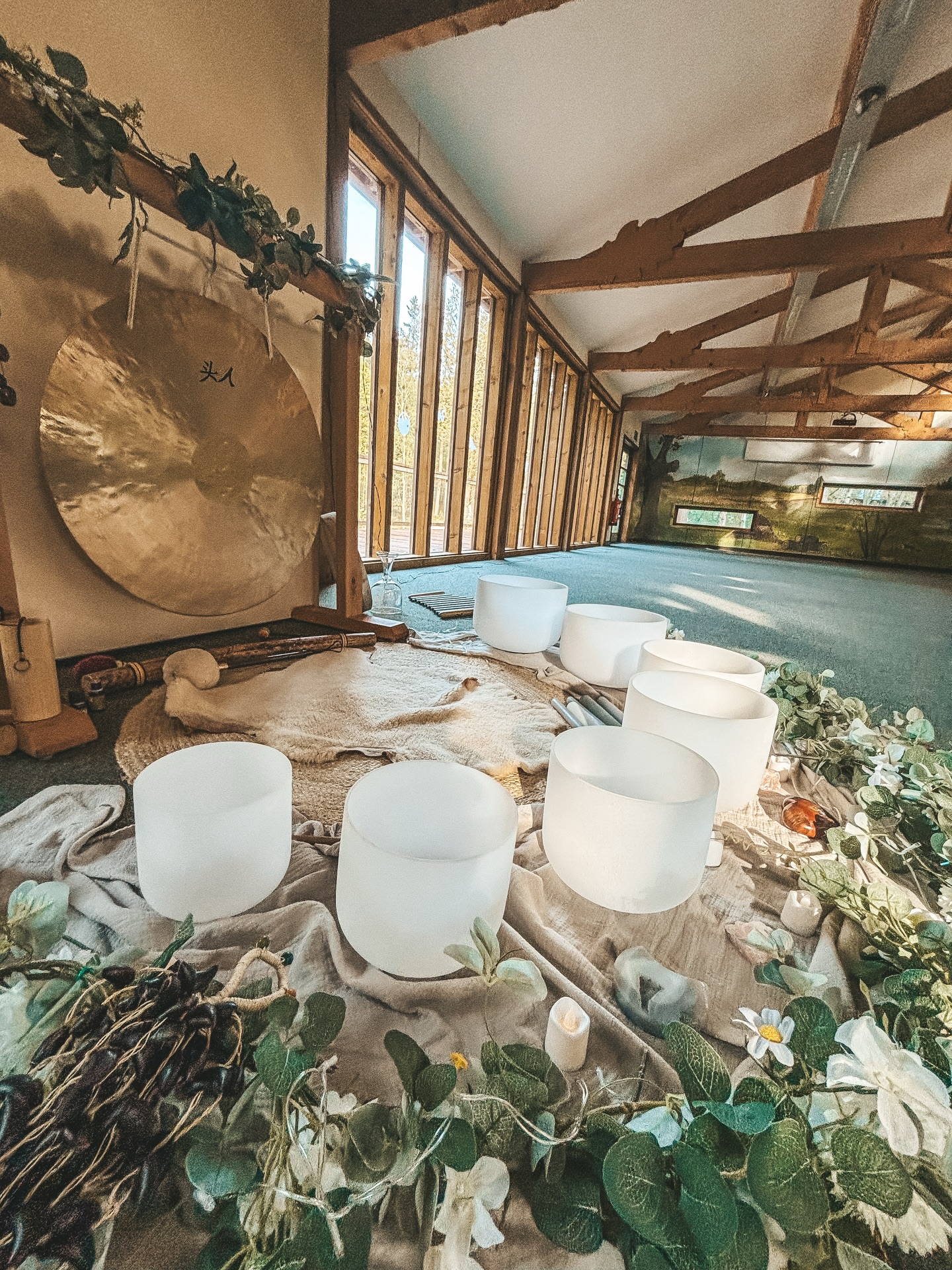 Let’s release, let’s check back in, let’s learn how to soothe our body & mind with sound. We may spend so much of our lives feeling hyper alert or hyper sensitive. Between the never ending communication on our phones, the demands of work, and the mental load of daily life, our nervous systems often get stuck in a sympathetic state (fight or flight). Yoga, meditation and sound bathing are wonderful modalities that can help you rebalance, calming the nervous system, aiding sleep and help you to create more ‘space’.
If you have never attended a sound bath I just wanted to share a little snippet of what you can expect.
As you lay down and rest, you will hear a sound scape unravel, alongside these delicate, deep, soothing and sometimes curious sounds it is a physiological reset.
When you immerse yourself in the frequencies of crystal bowls, gongs, or chimes, your body undergoes a beautiful transformation.
A transformation occurs, from noise to resonance, the vibrations physically vibrate the water in your cells, acting like a cellular massage to release stored tension.
The sounds help guide your brain from the active Beta state (thinking/doing) into the Alpha and Theta states, the “rest zone” where deep healing and subconscious processing happen.
These frequencies help stimulate the Vagus Nerve, the body’s pathway for deep relaxation, telling your heart rate to slow and your muscles to soften.
I adore sharing these cosy sessions within the forest space, with fairy lights, cushions, thick blankets, there is absolutely nothing for you to achieve, no judgement, no expectation. You just have to lie down, close your eyes, and let the sound waves wash over you.
I share sessions monthly and would love to welcome you into the space, anytime. If you feel called for a deep rest practice get in touch! ☁️
www.wildloveyoga.com
#singingbowls #soundbath #worcester #worcestershire #hereford