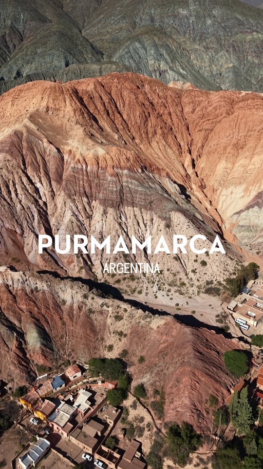 From the air, Purmamarca feels almost unreal. The village sits quietly at the base of the Cerro de los Siete Colores, where layered hills rise in soft waves of red, green, ochre, and purple. A drone shot really shows how dramatic the landscape is, with colors shifting as the light moves across the valley.
Purmamarca is small and deeply rooted in Andean culture. The population is largely Indigenous, with strong ties to traditional ways of life that are still visible in daily routines, architecture, and local markets. Adobe homes blend seamlessly into the earth tones of the hills, making the village feel like a natural extension of the landscape rather than something built on top of it.
Surrounding the town, the hills stretch in every direction, shaped by millions of years of geological history. From above, you can see how isolated and protected the valley is, which explains why the area has remained so well preserved. It is quiet, grounded, and timeless, a place where nature and culture coexist without competing for attention.
Purmamarca is not just a visual landmark. It is a living community set inside one of Argentina’s most striking landscapes, and seeing it from above only deepens the appreciation for how connected the people are to the land.
#Purmamarca
#JujuyArgentina
#NorteArgentino
#CerroDeLosSieteColores
#DroneArgentina
#DroneTravel
#SouthAmericaTravel
#VisitArgentina
#DiscoverArgentina
#AndesMountains
#AndeanCulture
#IndigenousHeritage
#SlowTravel
#RemotePlaces
#LandscapeLovers
#EarthTones
#TravelDrone
#HiddenArgentina
