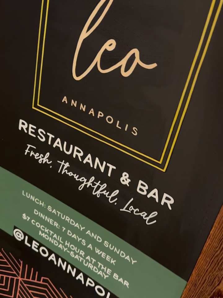 After 3 years, it was time for a chalkboard refresh at Leo Annapolis!
Yes, you read that right. The previous chalkboard held up beautifully season after season for several years. The artwork stayed strong, with minimal touch ups, but ultimately after daily use, the chalkboard reached the end of its run.
Projects like this are a reminder of why we love partnering with local businesses. Thoughtful signage isn’t just decorative — it’s part of the client experience. A sidewalk chalkboard, like Leo’s, invites people in, sparks curiosity, and sets the tone before a guest ever opens the door. It’s quiet branding, done well.
Our commercial chalkboards are fully customizable based on your space and needs — whether you’re looking for artwork that’s completely removable with traditional chalk, semi-permanent using water-based materials, or a more durable, weather-resistant option designed for longevity.
With proper care and storage, these boards can last for multiple years, making them an intentional, long-term investment for restaurants, cafés, shops and businesses that value both custom artwork and function.
If you’re a local business looking to elevate your storefront or interior with custom artwork, I’m currently booking commercial projects — inquire to start the process. 🤍