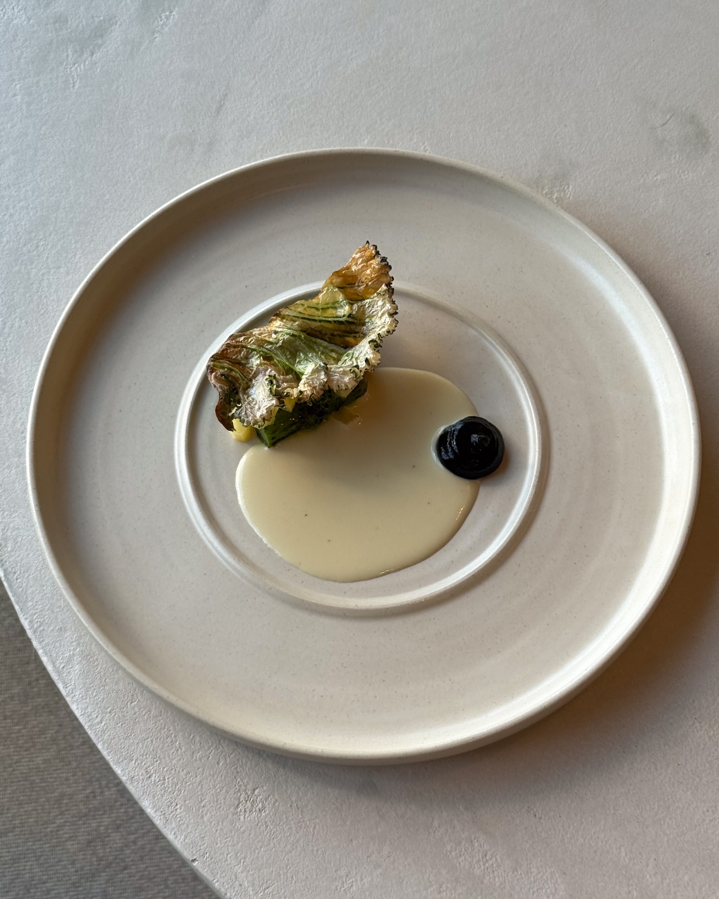 A celebration of the humble brassica, cooked on the Japanese BBQ and complemented by the flavour of three-cornered leek, with a yeast and koji sauce to finish.