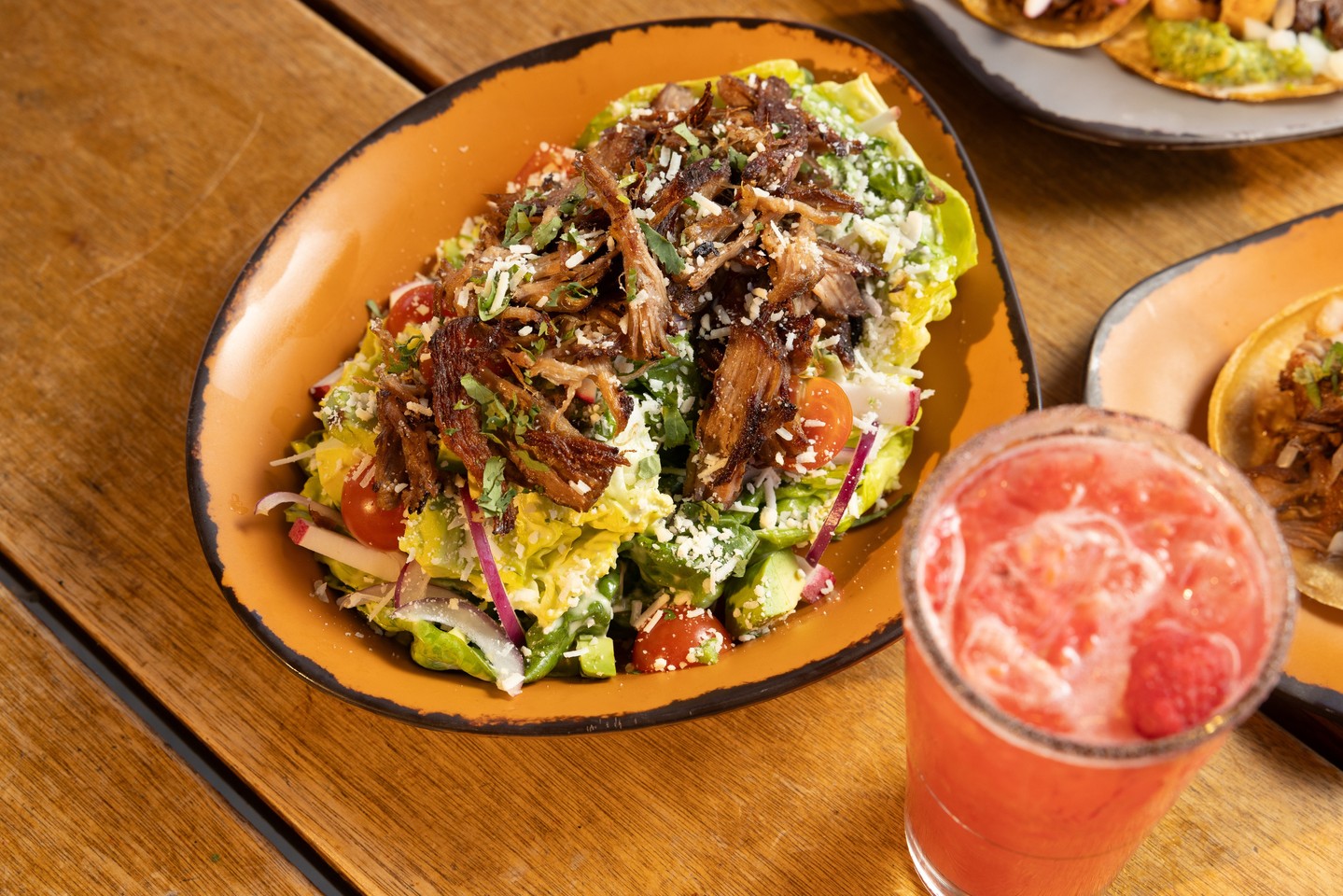fresh, crunchy, and packed with flavor 🥗our carnitas salad with baby gem, radish, pickled oni....