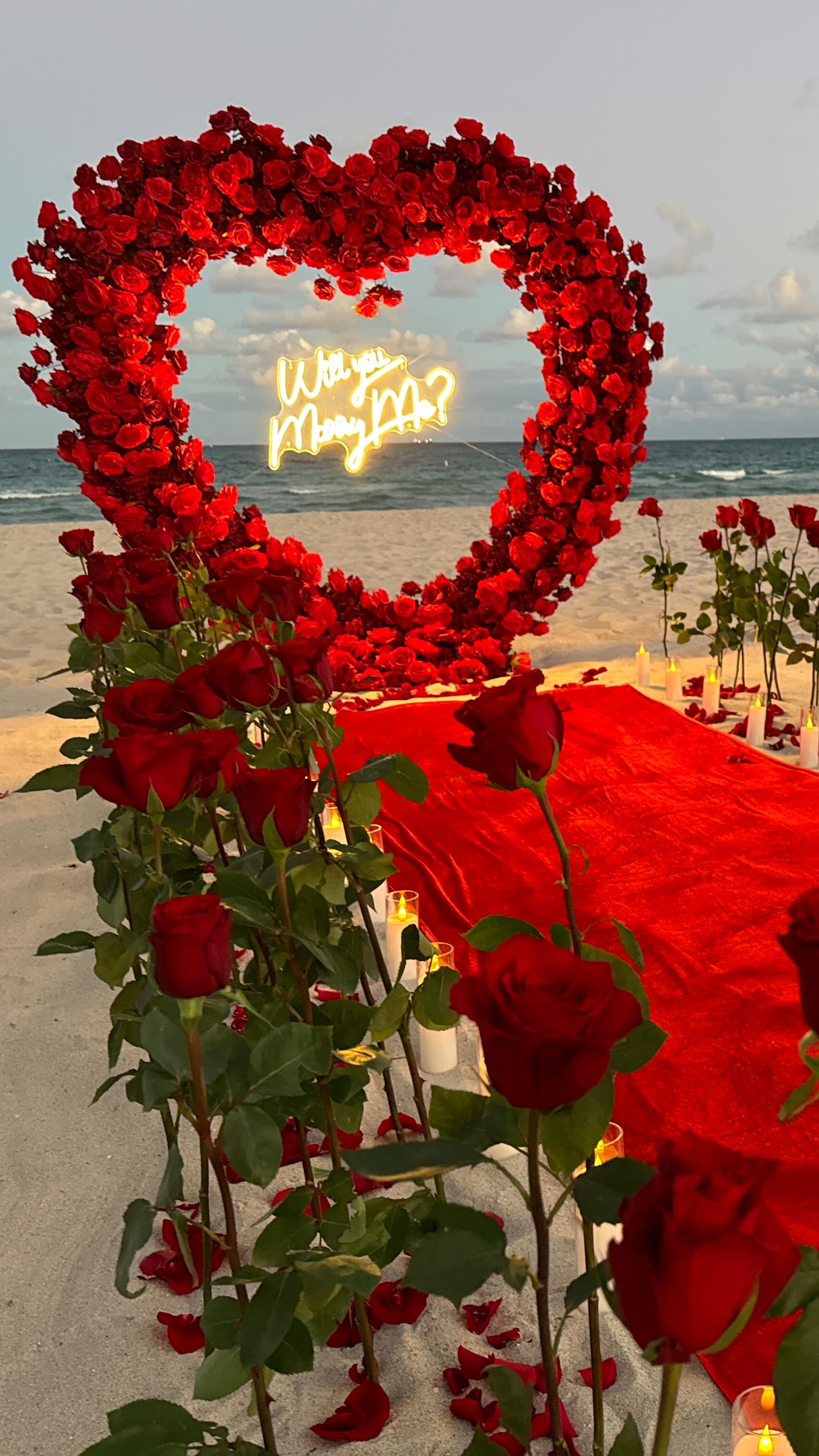 A luxury beach marriage proposal, designed as a bespoke experience.
A heart-shaped arch, fresh roses, an elegant aisle, and candlelight by the ocean.
Every detail is curated to create a rare, intimate, and unforgettable moment.
✨ Luxury marriage proposal planning
🌊 Romantic beach setup
💍 Bespoke exclusive experiences
👉 Private message for a personalized creation
Luxury Proposal | Beach Proposal | Miami Proposal | Proposal Planner