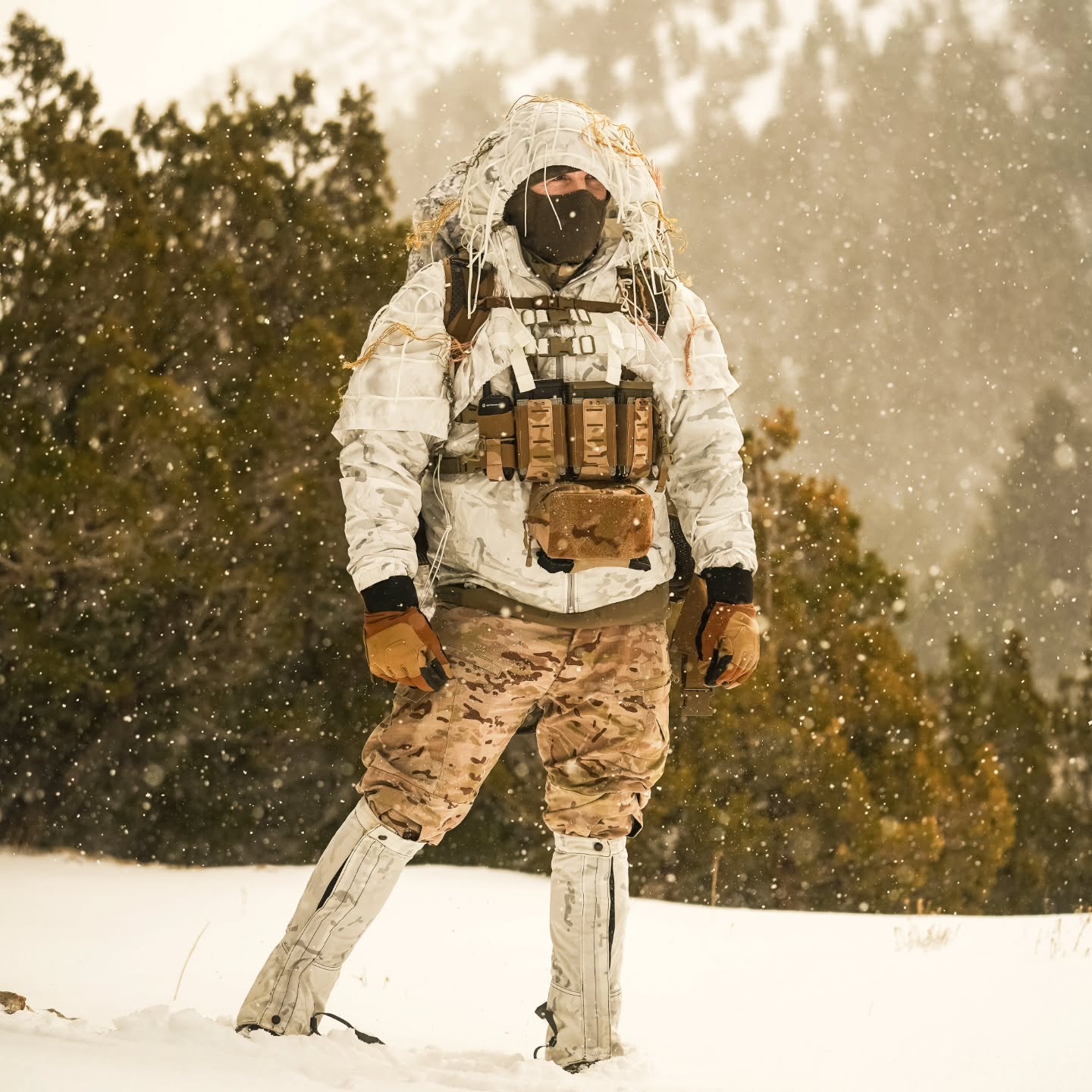 VOID Recce Cobra
Designed with Reconnaissance and Sniper Operations in mind, the VOID Recce Cobra is an Arctic-terrain, DoW-compliant, over-white option.
Features:
+ Nylon Para-Cord Lattice-Grid and Vegetation-Tie-Cords w/Cord Locks bar-stitched throughout the entire outer shell of the garment. These support the attachment and holding of natural foliage in place to achieve maximum results, enabling the end-user to blend seamlessly into the natural surroundings.
+ Hood features a Hood-integrated Veil that can be draped over the End-user's Weapon System or Observation Platform, enabling optimal lowering of the firing position's overall visual spectrum signature. The rifle veil can be rapidly removed in an emergency situation via an integrated QD "Rip Cord" veil-to-hood attachment design.
+ Garment fastening and adjustment features are rated to –30 degrees Fahrenheit to enable extreme cold-weather operations.
+ Button removable long sleeves for modularity. This enables the End-User to "Scale-down" their overall over-white coverage, allowing them to blend better within mixed green/white terrain spaces.
+ 70D DWR (Durable Water Resistant) Coated VOID “Eclipse” substrate textile produced by Brookwood Rolled Goods exclusively for Sniper Dynamics. This allows our VOID Cobra to easily shed snow and light mist, with a rain repellency of several minutes.
+ Adjustable one-size-fits most. Sized to be worn in conjunction with U.S. military Gen 3 Level 7 Cold Weather System Parka plus full gear loadout, including chest rig. plate carrier, backpack, and ECH / MICH helmet with Dual or Quad-Tube NVG and other attachments.
@tacticalconcealment @brookwoodcompanies @reccesniper_official @jblm_snipers @1_11_snipers @1stsfgroup