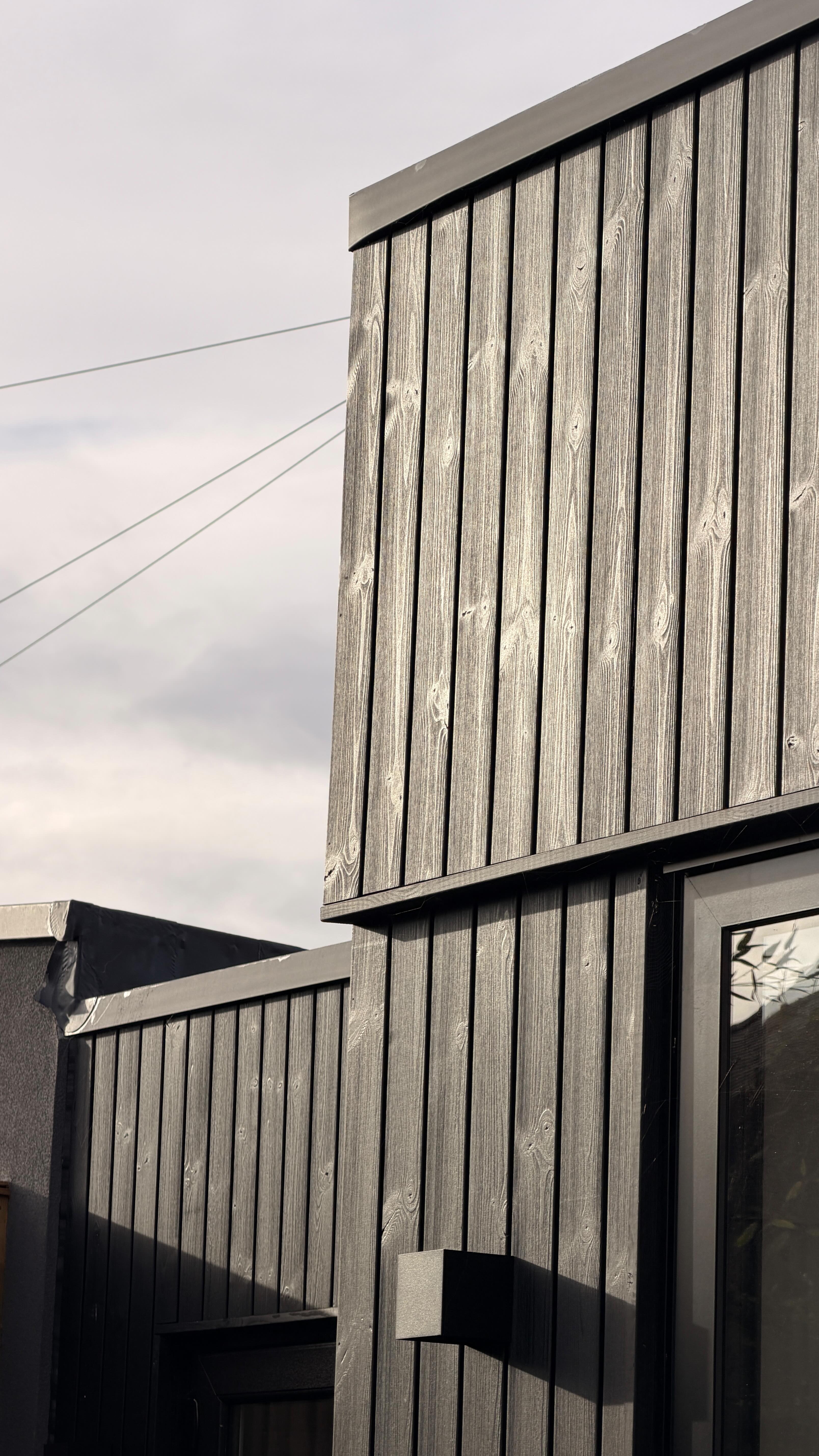 A family home extension and loft almost completed in Penylan, Cardiff.
A modern, sleek finish using black Thermowood cladding from @millworkstimber We specified the 19x93mm MW2 hidden-fix profile, brushed and finished in black for this beautiful, high-quality result. It looks stunning in the sun.
Excited to share more from this project. It’s been a pleasure working with @c_m_development @cook.brown.south.wales.josh @openviewglazingltd @gjpwired.co.uk @indies_structures @elecitycardiff @tymawrlime
#CardiffArchitect #Penylan #cardiff #WelshArchitecture #timbercladding