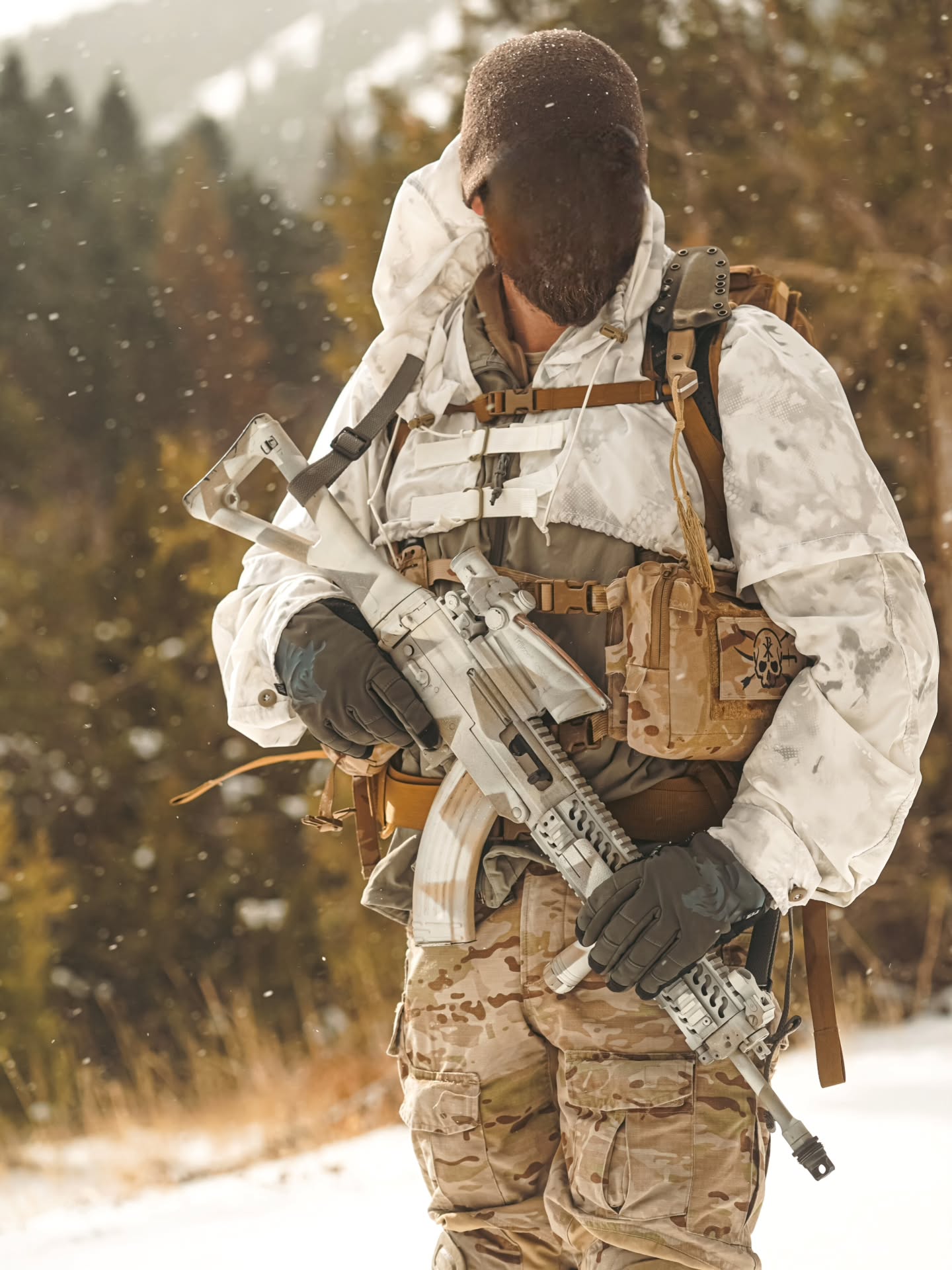 VOID Over White Cobra
The VOID Cobra is an Arctic-terrain concealment outer layer and a DOD-compliant over-white option. Garment fastening and adjustment features are rated to –30 degrees Fahrenheit to enable extreme cold-weather operations.
Features:
+ Button removable long sleeves for modularity. This enables the End-User to "Scale-down" their overall over-white coverage, allowing them to blend better within mixed green/white terrain spaces.
+ 70D DWR (Durable Water Resistant) Coated VOID “Eclipse” substrate textile produced by Brookwood Rolled Goods exclusively for Sniper Dynamics. This allows our VOID Cobra to easily shed snow and light mist, with a rain repellency of several minutes.
+ Adjustable one-size-fits most. Sized to be worn in conjunction with U.S. military Gen 3 Level 7 Cold Weather System Parka plus full gear loadout, including chest rig. plate carrier, backpack, and ECH / MICH helmet with Dual or Quad-Tube NVG and other attachments.
@tacticalconcealment @brookwoodcompanies @arcticwolvespao