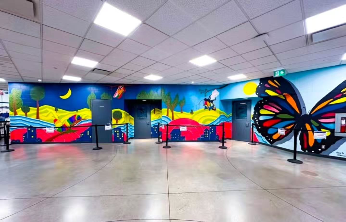 I love the overall vibe of this mural. It is located in the Nanaimo Aquatic centre. Humanity In Art co-created this artwork in collaboration with Youth from the Risebridge IBPOC summer program. The project was sponsored by the Office of the BC Human Rights Commissioner as part of their "Hate to Hope" campaign. The youth led the charge discussing themes of interconnectivity, and the type of community they want to live in and during our drawing sessions the older group kept drawing insects while the younger group was focused on that inner connectivity of lines and community.
From there this artwork was created. Being a Trans person we also snuck in some subtle Trans symbolism as the site was the focus of some serious community led transphobia earlier in the year.
The initial sketch was also turned into coloring pages and then the BCOHRC toured an exhibit around different communities that showcased all the murals created from this project as well as the complex storytelling from marginalized communities throughout BC. They did a fabulous job with the overall exhibit and it felt really cool to be a part of this. We had many hiccups along the way, but it turned out great and I personally love seeing the artwork when I visit the aquatic centre.
(Artwork created by Humanity In Art which was the artistic partnership between Lys Glassford and Lauren Semple ™️)
#wallmural #customart #publicart #commercialart #nanaimosmallbusiness