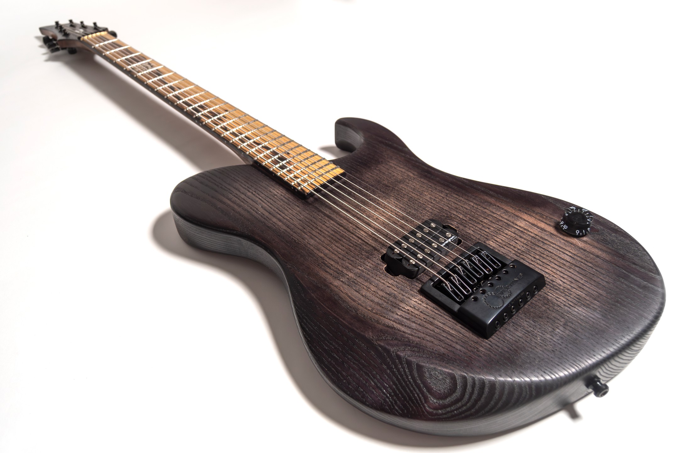 Here's some snaps of the most recent Daedalus build (No.0040). This total riff beast was created for @latehonkola as a live guitar for @kollectivist_official
It features a @lundgrenguitarpickups M6 pickup, @evertune bridge, locking tuners, brass nut, 28" scale length, ash body, 3-piece walnut neck, and a gorgeous pale moon ebony fretboard from @vanderwel_woods
Super proud of this one to be honest. #ipguitars #baritoneguitar #customguitar #handmade #madeinfinland #metalguitar #kollectivist