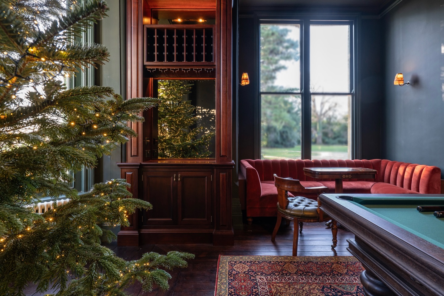 Our first post of 2026 and we’re kicking things off with a rather special project ✨
This games room / library was designed to feel bold but comfortable. With a generous ceiling height, a deep colour felt like the natural choice, grounded by dark woods and carefully chosen vintage pieces.
A bespoke banquette tucked into the bay, a custom pool table, Victorian mahogany and leather library chairs, and a drinks cabinet made just for this space with African utile wood - all finished in time for Christmas, a 3.5-metre hand-picked tree sits quietly glowing with thousands of lights ✨
And this is only the beginning. This room is still evolving into a full library, with emerald velvet curtains and a few beautiful and fun details yet to come. 🖤
A big thanks to @lynnyoungart for the artwork, @fox_and_robin for the rug that fits perfectly, @houseofrussell_iw for the beautiful lamp and side tables!
Bespoke drinks cabinet @superiorbespoke2023 and @acorn_designandbuild
Photography @siennnaeva 🤩
Main contractor - @acorn_designandbuild
👏🏼