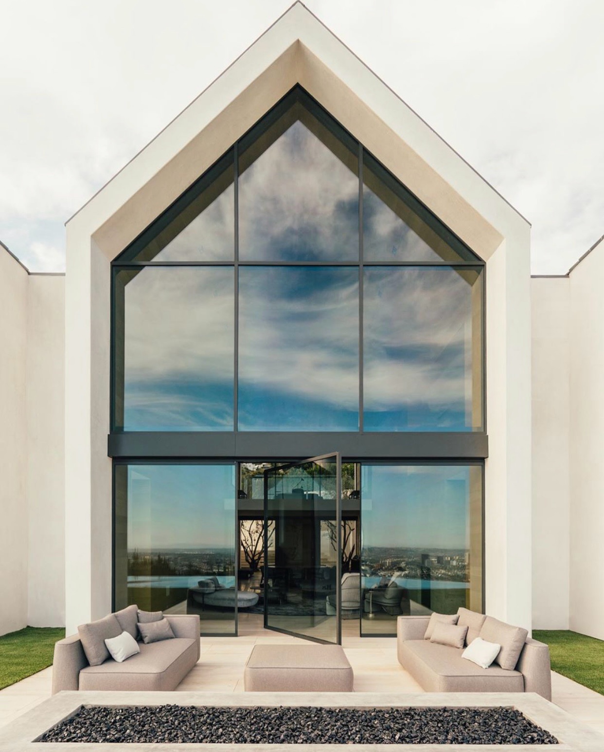 A study in restraint, precision, and proportion. This residence is defined by the seamless dialogue between our PD800 pivot door line and a custom curtain wall system, creating a unified architectural language across the façade.
The PD800 features the narrowest profile pivot door on the market, anchored by a refined 3/4 inch vertical profile that carries through the curtain wall for visual continuity. A 1-15/16 inch coplanar astragal maintains clean sightlines while delivering structural confidence at scale.
Minimal profiles, maximum transparency, and a fluid transition between interior and exterior. Architecture distilled to its essentials.
#Styline #PD800 #PivotDoor #CurtainWall