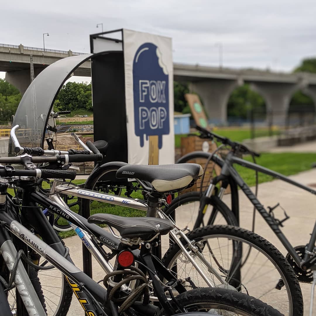 Bikes of a feather...the quadcycle is hanging out at the bike racks at Riverheath Concert series