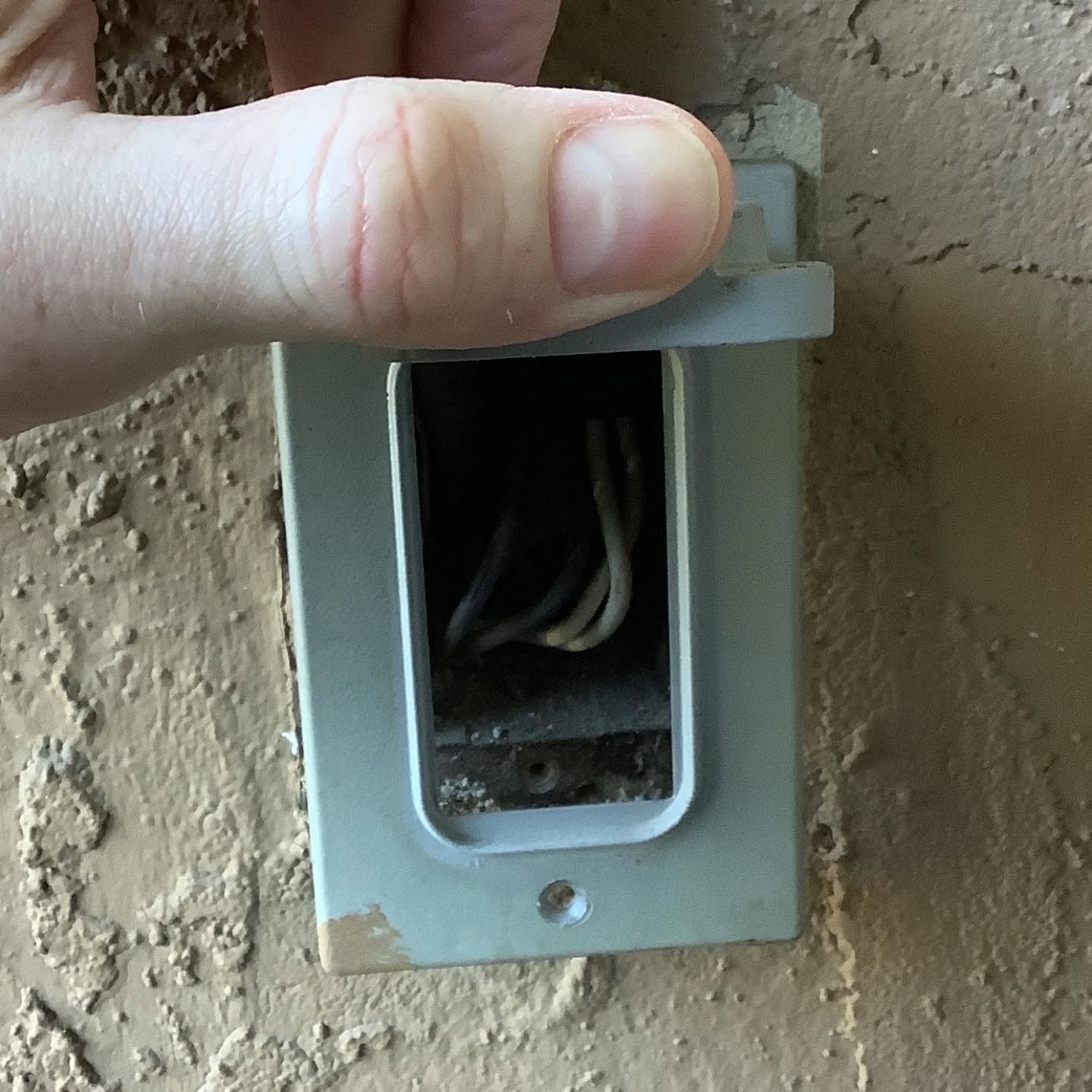 It's time for the defect of the day! Woot!
Today's defect is a missing receptacle behind a cover plate on the balcony of a condo. The Romex was tucked back into the junction box, ends taped over, and no receptacle. Who knows why this condition exists, but it will certainly be a nuisance to anyone needing power on the balcony.
The recommendation is installation of a new water resistant GFCI 15 amp receptacle by a qualified electrical contractor.
I hope you enjoyed today's defect of the day!