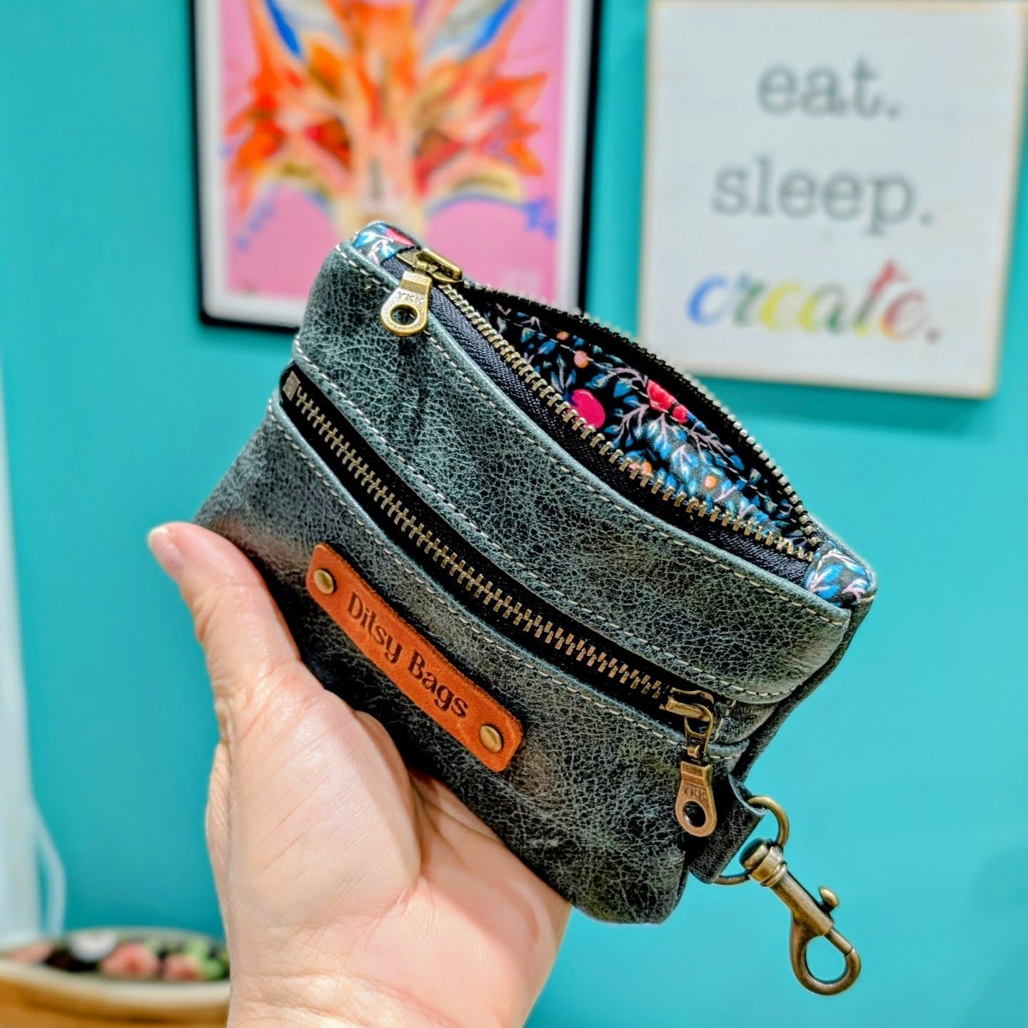 Hello all! These "two-zip" wallets are taking over my life and my craft room. Etsy's algorithm loves them! So many fabric and leather options to choose from. Get yours now while there's a sweet 25% off until the end of January.
This might be the handiest little purse you buy. There's even a clip for a key, or to clip the purse safely inside another bag (which of course, you can also buy from me) 😉
It's a tough ol' World out there for small businesses these days, so make yourself feel good (and myself) by buying something beautiful, handcrafted and unique.
#shopsmall #supportsmallbusiness❤️