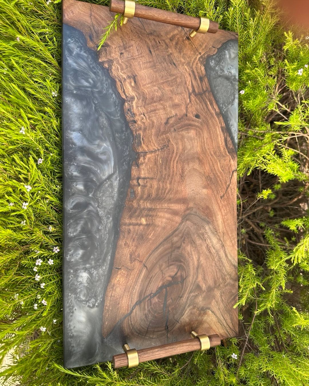 Live edge olive and some interesting gray/white swirly resin creates this serving tray.