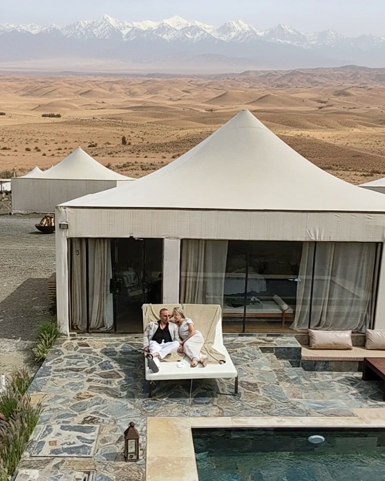 Luxury glamping in the Agafay Desert, just outside Marrakech 🏜️
Despite looking like rolling dusty dunes, Agafay is actually a vast stone desert, shaped by wind and time, with the snow-capped Atlas Mountains often visible on the horizon. It’s one of Morocco’s most unique landscapes.
Staying here feels like unplugging from the whirlwind of life while enjoying the romance of being in the quiet desert, but with hotel-level comfort: private terraces, plunge pools, linen-draped tents, attentive service and evenings spent under beautifully clear skies for star gazing. Days are slow and sun-soaked, nights are calm and candlelit, and the stillness is something you really feel. >> ps how cute is the lodge door key 🤩🔑 >>
A reminder that Morocco isn’t just about the medinas and souks, its wild, open spaces are just as unforgettable.
Would you add this to your Morocco itinerary?
Useful details ⬇️
🚗 Approx. 45 minutes by car from Marrakech city / Marrakech Menara Airport
📍 Around 30–40 km southwest of Marrakech
🏕️ White Camel Lodge @thewhitecamelagafay - Prices typically start from £180–£300+ per night, depending on season and tent type (we stayed in the pool lodge)
👉🏻 Follow @sammylouluxe for more unique luxury stays, family lifestyle and bucket list moments 🤍
#agafaydesert #marrakesh #uniquestays #luxuryglamping