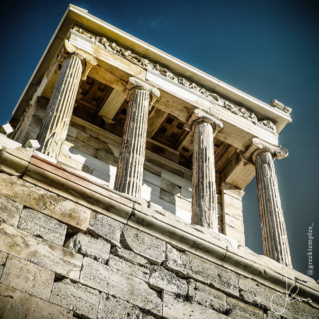 🏺🏛❗ The Magnificent Temple of Athena Nike was Recently Correctly Restored and is Ready to Reveal her Colorful Ancient Secrets!
◾◾◾
❗Full Text & Images: www.greektemplesnow.com
◾◾◾
As you are leaving and stepping down from the steps after the Propylea (towering entrance gateway) from the Acropolis, make sure to stop, turn around, and look up to the right so you don’t miss one of the most dazzling structures of the entire site; the temple of Athena Nike (421 BC)! The temple is positioned at the absolute edge of the southwest corner of the site and has always felt to me as a majestic griffin acting as guardian of the much larger Parthenon and Erechtheion. The amphirostyle and apteral temple of Athena Nike likely was designed by the fabled architect Callicrates who along with Ictinus roughly 20 years earlier co-designed the Parthenon.
◾◾◾
Athena would not be amused to learn that by the 5th c. AD her temple had been converted into a Christian church! However, her wrath would be fully-fledged when in 1686, the Ottomans dismantled the temple to use its marble components to enhance a fortification wall nearby! Luckily multiple reconstructions attempts from 1836 all the way until 2010 have been fruitful resulting in an accurate restoration that Athena would approve!
◾◾◾
It is disappointing that today the word Nike echoes loudest with the US multinational corporation Nike Inc. Perhaps a fitting brand name for the victory of capitalism nonetheless! Stranger still today in Greece, we Greeks pronounce the footwear brand Nike, as “Ny-Kk” rather than “Ny-Kee” as is common in the US. Rather bizarre indeed as “Ny-Kee” is closer to the original Greek pronunciation of the word (“Nee-Kee”).
◾◾◾
Date of Visit: Nov 22, 2021
◾◾◾
#wanderlust #picoftheday #photooftheday #architecture #greektemples #ig_greece #temple #travelblog #travelgram #letsgo #goexplore #travelphotography #discovergreece #parthenon #greekbloggers #athenanike #greece_all #greece_is_awesome #adoregreece #greece2021 #go_explore_greece #wu_greece #athensvoice #canongreece #reasontovisitgreece #travel #instalifo #ancientgreek #acropolis #mythology