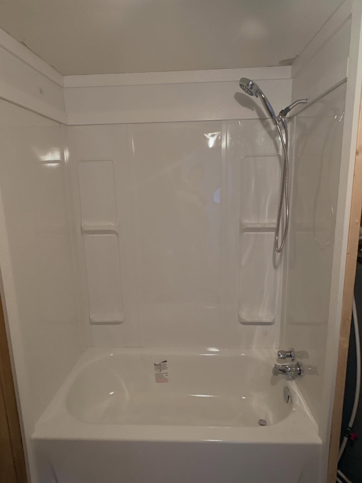 Today we installed a cost effective small tub and surround for old mobile home client using pvc trim for a Wainscoting look.