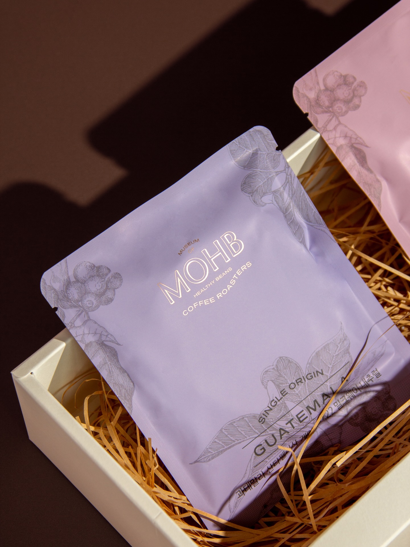 MOHB Coffee Roasters is a specialty cafe from South Korea known for its unwavering dedication to quality — from bean selection to the very water used for brewing.
Our work began by uncovering the deeper connection between nature and coffee, shaping a brand identity that reflects warmth, balance, and authenticity. This foundation inspired everything from strategy to visual language, packaging, and tone of voice.
The result is a cohesive identity system that feels organic yet refined — a reflection of MOHB’s philosophy of harmony between craftsmanship and nature.
—
We design brands that feel right, because they are built right.
Award Winning Brand Design Studio with focus on Strategy, Brand Identity, Packaging and Web Design.
#branding #brandidentity #packagingdesign #coffeebranding