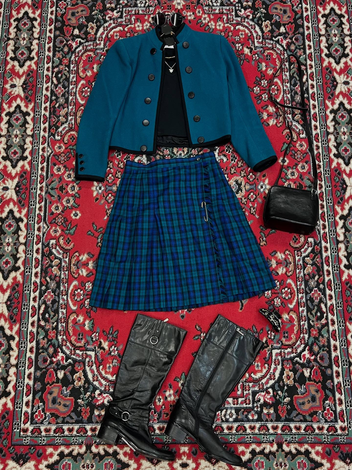 Preppy but not boring - Lee put together this fun look for you! I have been seeing a lot of people on TikTok making midi tartan skirts look so cool and modern! #couchsaleswithldr #ldrstaffpicks (blazer color is most accurate in second photo!)
DETAILS:
Glasses- $21
Necklaces- Silver $23, Gold $32
Jacket- Yves Saint Laurent, 30, $97
Tank Top- Inclination, S, $26
Kilt- Vintage, 10, $33
Purse- Hobo, $55
Claw Clip- $8
Boots- Bandolino, 8.5, $28