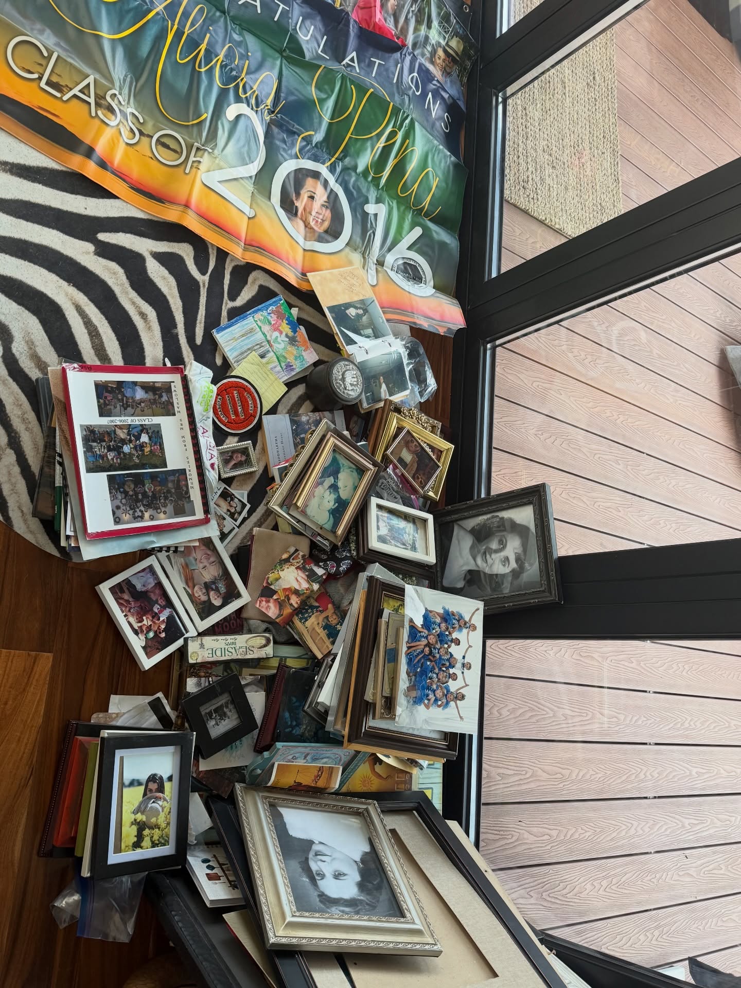 Unpacking a life looks like this.
Photos. Frames. Old versions of me.
People I loved. People I lost.
Moments that mattered more than I realized at the time.
A floor full of memories.
Being a nomad means your life lives in totes and storage units, and you carry only what fits in your truck as you move through the world. Across borders. Across oceans. Across seasons of who you were becoming.
This morning, coffee in hand, sunlight pouring through the windows, I feel settled for the first time in a while. I’m unpacking my life slowly — piece by piece — pulling out a lifetime of memories.
People I’ve lost.
People I’ve loved.
Friendships that came and went.
Friendships that became family.
Adventures.
Different states.
Different beaches.
Different skies.
Different sunsets.
Watching my daughter grow.
Living whole lives inside moments I didn’t know were shaping me.
And here I am — settling into a new chapter.
Learning what it means to land.
To root.
To become a grandmother.
To find my new normal.
Not letting go of who I’ve been — just making room for who I am now. 🦋