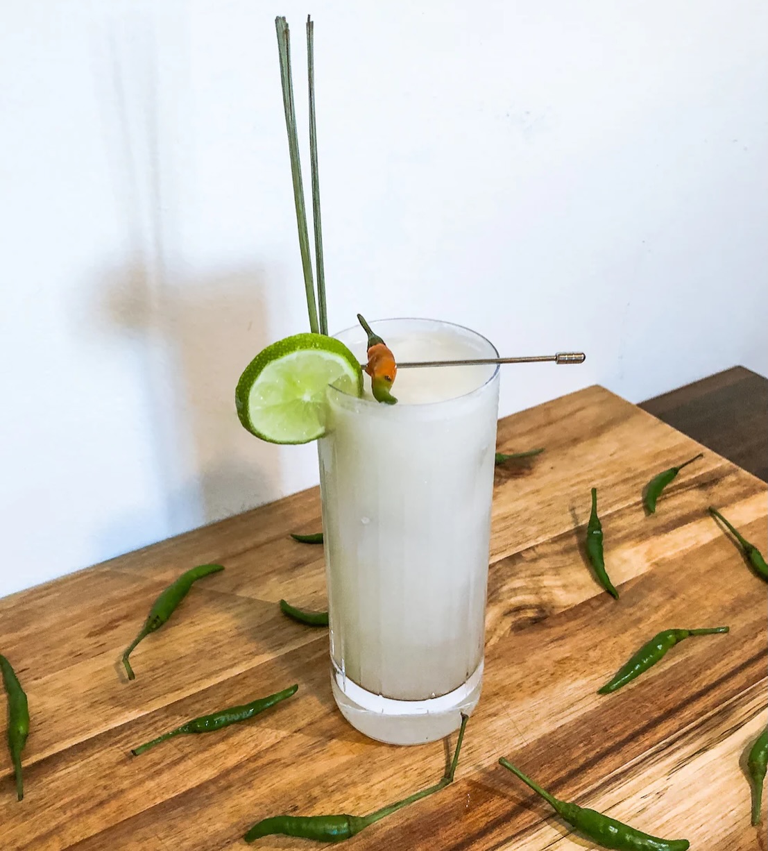 January in the UK ❄️
Meanwhile… one of our directors is somewhere in Thailand 🇹🇭☀️
So we thought we’d post a drink we saw him knocking back.
Siam Sunray 🌞
Zesty lime, coconut, ginger heat and a little Thai kick — basically a holiday in a glass. Tom Yum vibes, but make it cocktail 🍸🔥
If you need us, we’re mentally on a beach.
Cheers to escaping the January blues. 🏝️✨
Siam Sunray (Thailand’s Signature Cocktail)
This cocktail is known for having similar flavors to Tom Yum soup.
Ingredients:
50ml Vodka
25ml Coconut Liqueur
1/4 oz Fresh Lime Juice
1/2 inch fresh Ginger, sliced
1 Thai Chili (optional)
Lemongrass stalk (optional garnish)
Method: Muddle ginger and chili (if using) in a shaker. Add vodka, coconut liqueur, lime juice, and ice. Shake well and strain into a chilled cocktail glass and top with coconut milk.
