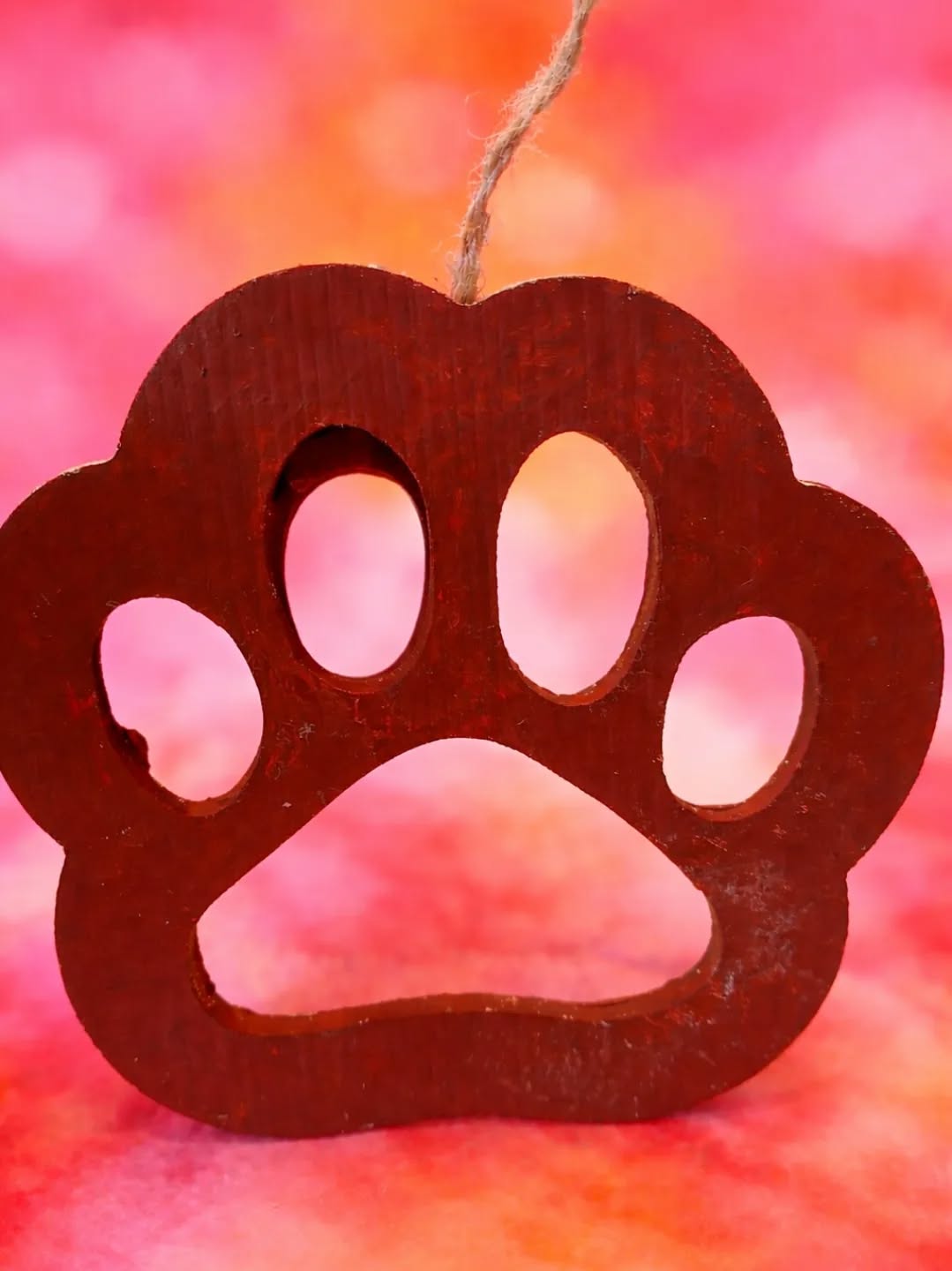 This brown wooden paw print wall hanging wall decor is a medium-sized sign perfect for any room in your home. Hand-painted with intricate details, this decorative piece adds a personal touch to your living space. Made from wood and weighing only 1 lb, it requires no additional parts for installation and can be easily cleaned with a damp cloth. The hanging design allows for easy display, making it a charming addition to any room for adult homeowners looking to enhance their decor with a touch of hand-painted artistry.