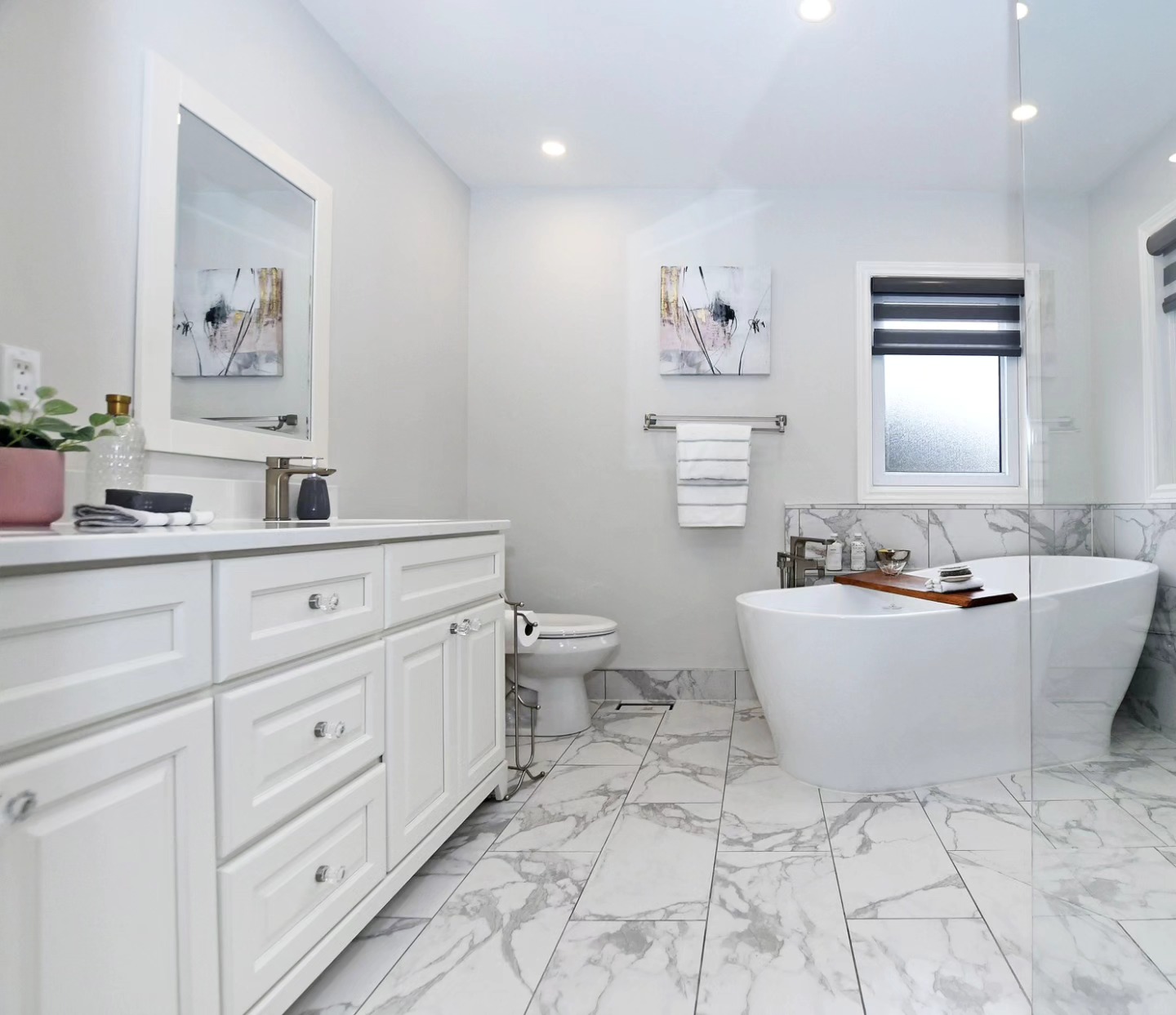 Fresh, spa-like ensuite bath anyone? These clients spent money to increase equity and it worked! #newmarketrealestate #newmarketstaging #bathroomremodel #ensuitebathroom #ensuiterenovation #freestandingtub #greyandwhite #stagedtosell #stagingsellshomes #buildequityinyourhome