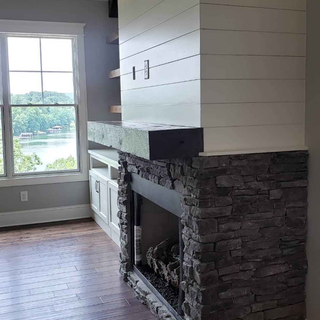 Shiplap, stone and a beautiful lake view. This is a unique fireplace design that turned out beautifully.
#customhome
#customehomebuilder
#jontotherowconstruction
#fireplace
#shiplapfireplace
#floatingmantle
#lakeview