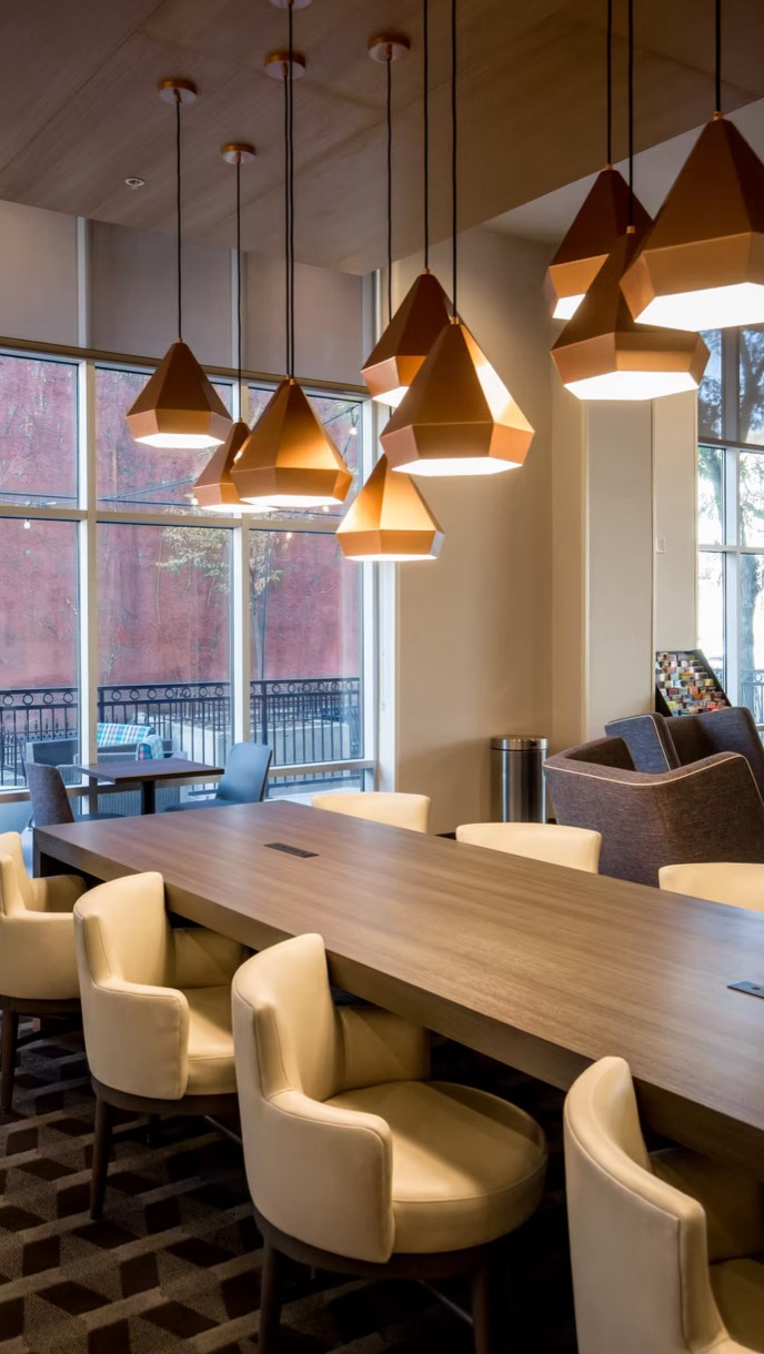 One of the most influential elements in hospitality design? Lighting.
Lighting that’s too harsh can make a space feel cold, sterile, and uninviting. Lighting that’s too dim may feel moody at first, but quickly becomes frustrating when guests can’t comfortably see, move, or settle into the space.
The key to great hospitality lighting lives in the balance. It supports comfort without sacrificing function, and atmosphere without being overwhelming. Layered lighting, thoughtful placement, and intentional color temperature help spaces feel comfortable, welcoming, and easy to be in every hour of the day.
When lighting is done well, guests don’t necessarily notice it right away, they just feel at ease. And that’s when design is doing its job.
Interior Design | Hospitality Design | Lighting | Lighting Design | Design Tips