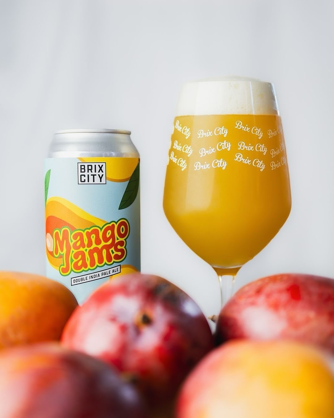 Now available via our distribution partners:
Mango Jams is our 8% ABV Milkshake style DIPA that’s brewed as a love-letter to sunny days on the beach! This fruit-forward Jams was brewed with Lactose, hopped with Citra and Mosaic, and conditioned on a massive helping of Vanilla and fresh Mango Purée.
Pouring this one into a glass reveals a super-saturated orange liquid and fluffy white head. Upon tasting, we get flavors and aromas of mango sorbet, sweet orange creamsicle, pink pineapple, and light citrus zest.