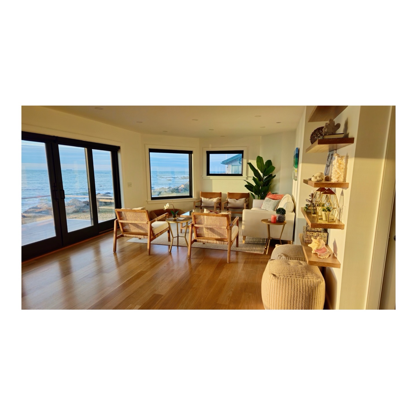 Tuesday One of our favorite views from a project we completed in Charlestown, RI. The entire interior was painted in Chantilly Lace, using different sheens to distinguish the ceilings, walls, and trim. Keeping one color throughout the home truly highlights the natural beauty of this oceanfront oasis.