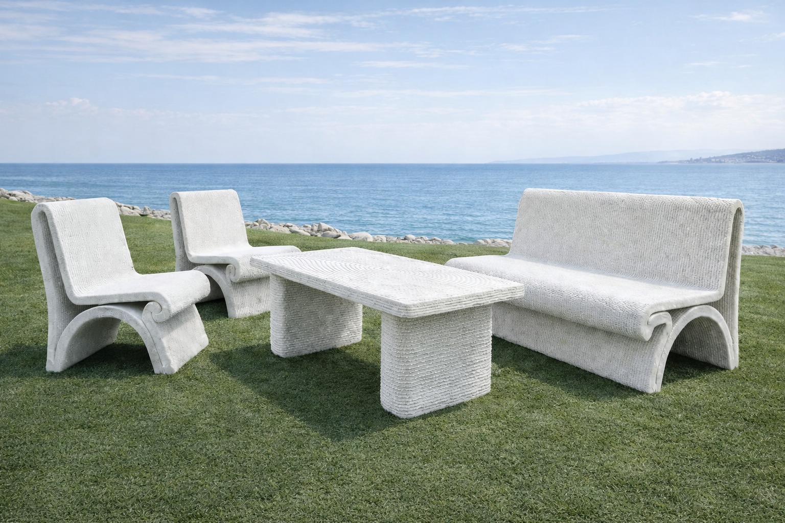 A coordinated outdoor furniture set with a consistent geometric language.
The collection includes seating elements and a table,
all sharing rounded profiles, smooth curvature,
and a uniform layered surface texture.
Each piece follows the same formal logic,
creating a cohesive visual composition
within an open landscape setting.
#3dconcreteprinting
#concretefurniture
#outdoorfurniture
#layeredmanufacturing
#freeformdesign
#digitalfabrication