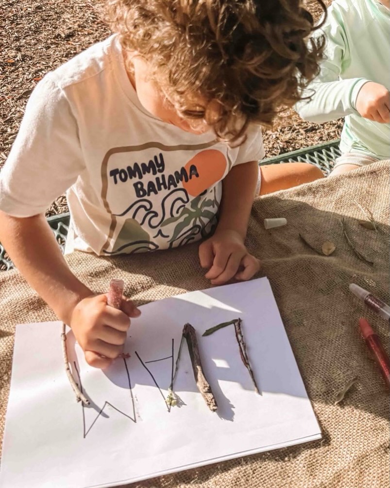 Learning can look like leaves, paint-stained fingers, and quiet concentration.
As children press leaves into their nature journals, they’re doing so much more than making art.
They’re strengthening fine motor skills, listening for the L sound in leaf, observing patterns and textures, and letting imagination lead the way.
Moments like these invite focus, creativity, early literacy, and a deeper connection to the natural world—all at once.
This is the beauty of learning in nature: simple materials, rich experiences, and space for children to grow in their own time. 🌿