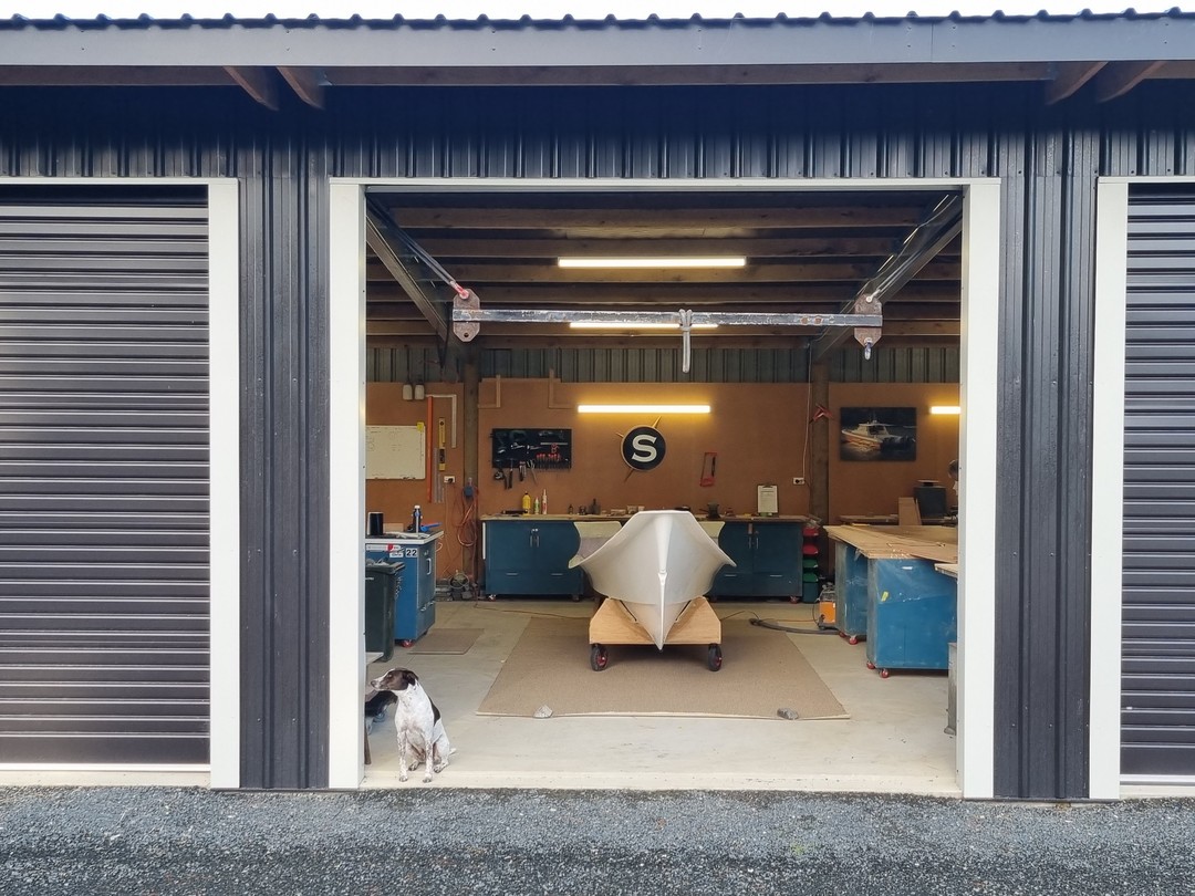 Our Head of Security, Oscar, takes his job very seriously as he watches over construction of the first of three new boats underway for Yachting New Zealand.
Where Yachting New Zealand already have five of the 6.2mtr Salthouse Coach Boats for their high performance program, these next three are 5.4mtr and aimed at the grassroots of club sailing.
Working with Yachting New Zealand is a hugely rewarding process as we tweak and custom design features to meet their requirements and produce a boat that is 100% fit for purpose.