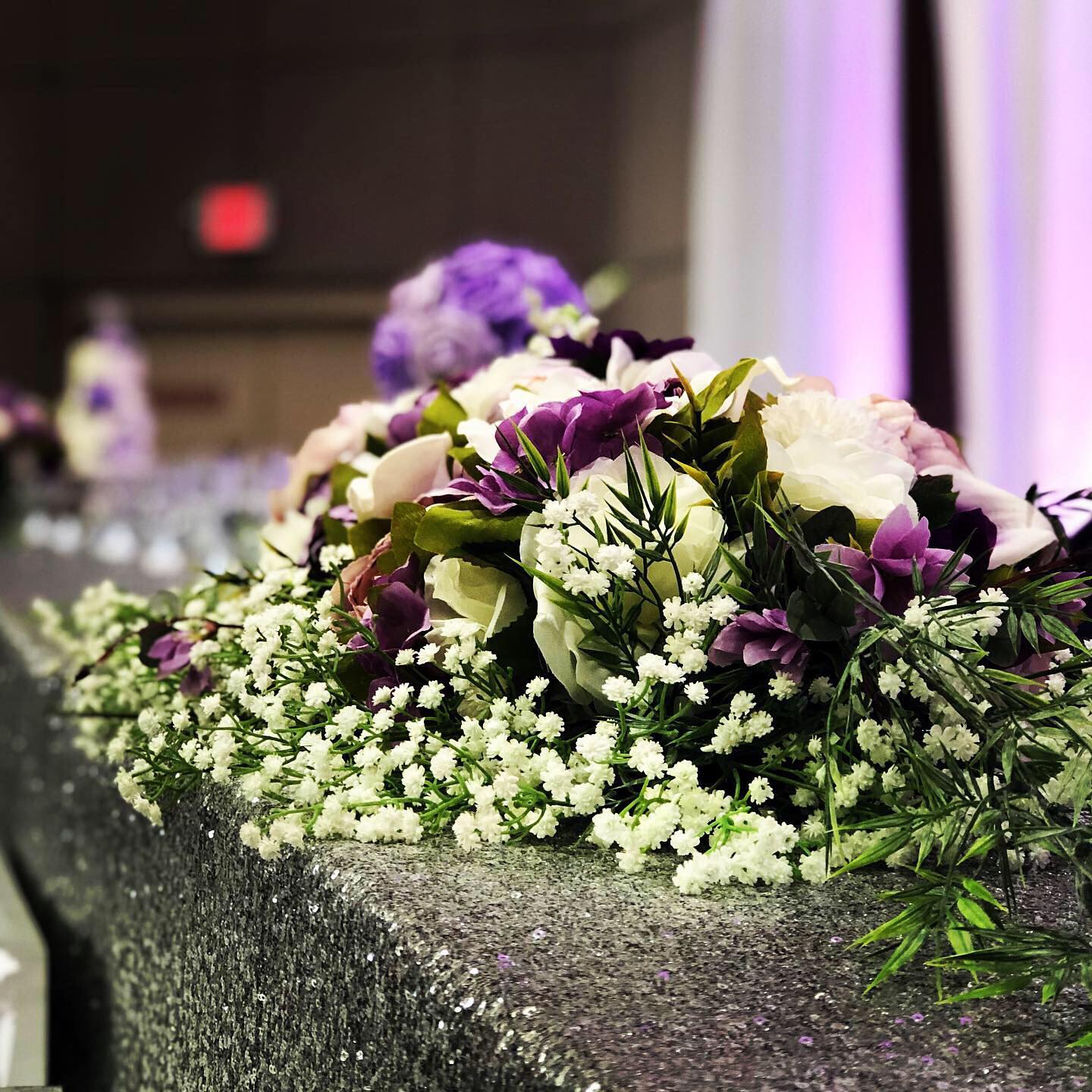 We are ALL about finding ways to repurpose your ceremony decor for your reception. It’s one of the ways to stick to a manageable wedding day budget.
One of our brides last year, made this beautiful faux flower arrangement which we simply attached to the arch (in the previous post) and was able to easily take down and transfer to the head table. What a great statement piece!