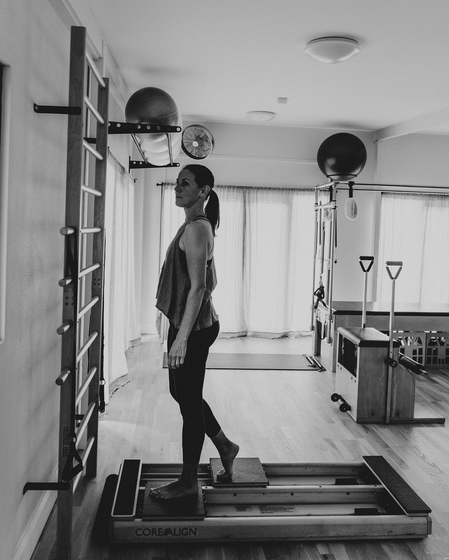 What does the word Gait mean? It is defined as your manner of walking, or ‘moving on foot’.
_
But strangely, we don’t always walk from our feet, instead sometimes we lead from the knee or the hip, often using more superficial (outer) muscles of the thigh and hip to pull the leg forward. One reason for this might be injury, or more commonly, ill fitting shoes or thongs do not allow the natural action of our feet.
_
I love the ‘Hoof’ exercise on the Core Align as it challenges the body’s ability to maintain its vertical line of gravity, and connects the feet in the ‘toe off’ phase of our gait pattern. It provides feedback and resistance for the sole of the foot as it moves the plate in the ‘toe off’ action, rolling from the heel to the ball of the foot, releasing the back of the knee and connecting the back line of the leg, the hamstrings and gluts, whilst maintaining the verticality of the head over pelvis.
_
Our thigh bone should actually hang from our spine, supported by our psoas muscle in what is called the ‘swing’ phase of our gait pattern. The psoas muscle is our only muscle that attaches our spine to our legs. It attaches along our lumbar spine from T12 under our diaphragm to L5, and inserts into our upper inner thigh bone. It acts as a pendulum supporting the swinging thigh bone through each step.
_
This exercise is much harder than it looks! I always feel like I walk stronger and easier after doing this exercise. I am more connected through my feet and back line of my body and have less tension in my lower back and front of hips. It is a great rewiring exercise for function, balance and connection to gravity.
_
If you’d like to move, walk, run stronger, then get in touch and join one of our semi-private classes. We have a full variety of apparatus to get you moving.
_
#pilatesandmovement #pilatesandmovementsunshinecoast #pilates #corealign #pilatessunshinecoast #sunshinecoastpilates #pilatescoolum #intelligentmovement #axialelongation #gravity #balance #fallprevention #betterfunction #morepower #walking #running #gait #proprioception #movementsciencemadesimple #movesunshinecoast #fitnesssunshinecoast #sunshinecoastfitness #jazzyconnorsphotography