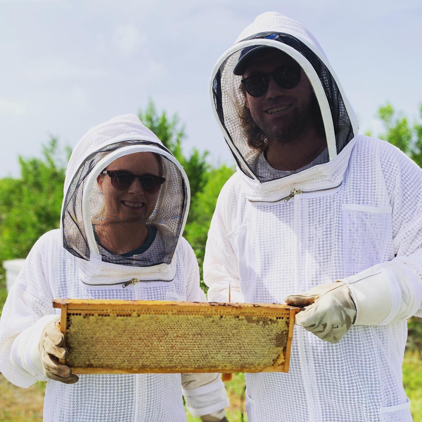 This awesome couple helped us out with the first honey harvest while on our beekeeping tour. Local Spring honey will be on shelves soon. Stay tuned! #honey #beekeeping #local #harvest #beetour #grandcayman #beekeeper