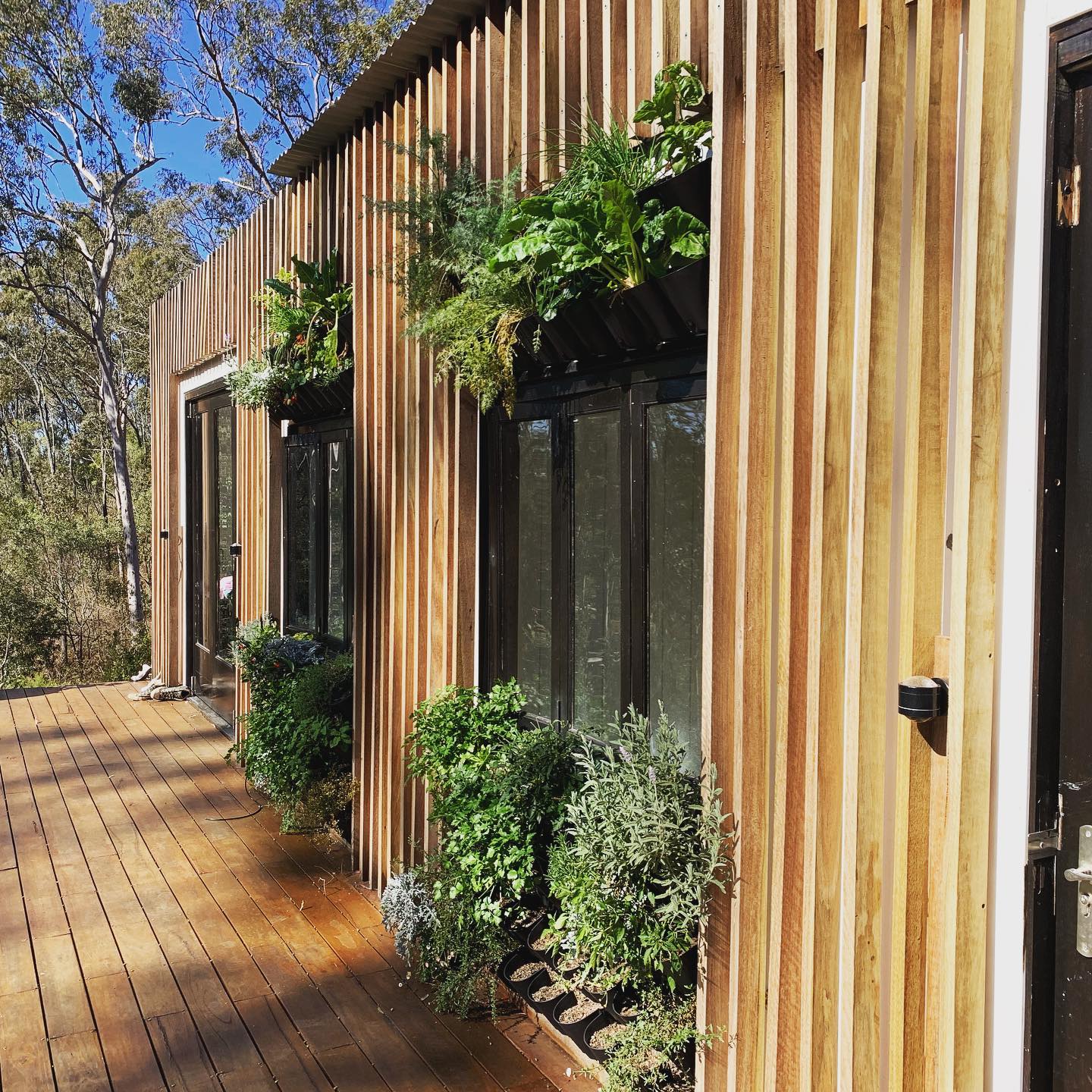 Vertical shading capturing passive solar on winters morning on our project in Brookfield, Brisbane #shippingcontainerhouse #passivhaus #permaculture